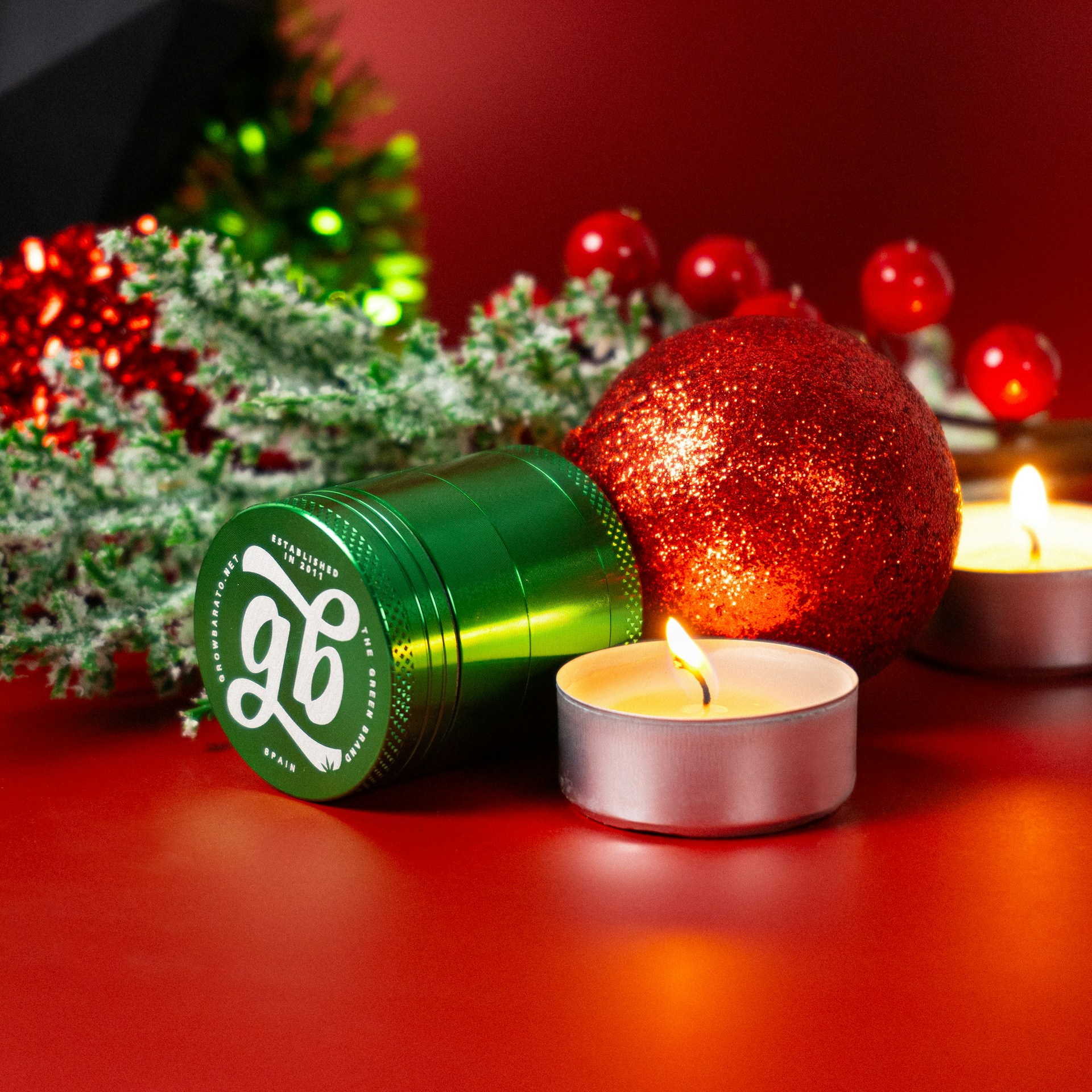 A candle and some christmas decorations on a table