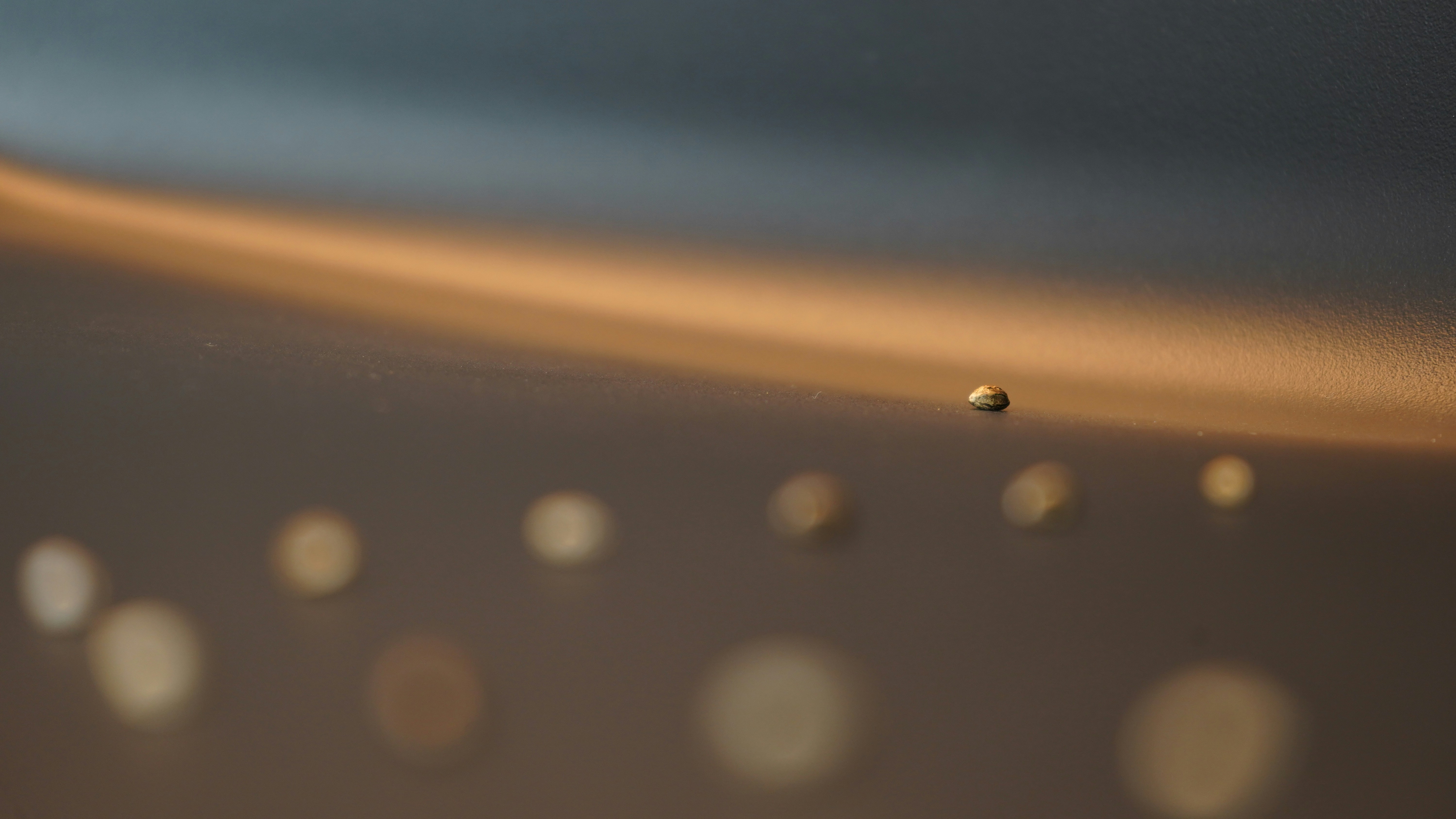 A blurry photo of a wall with a lot of dots on it