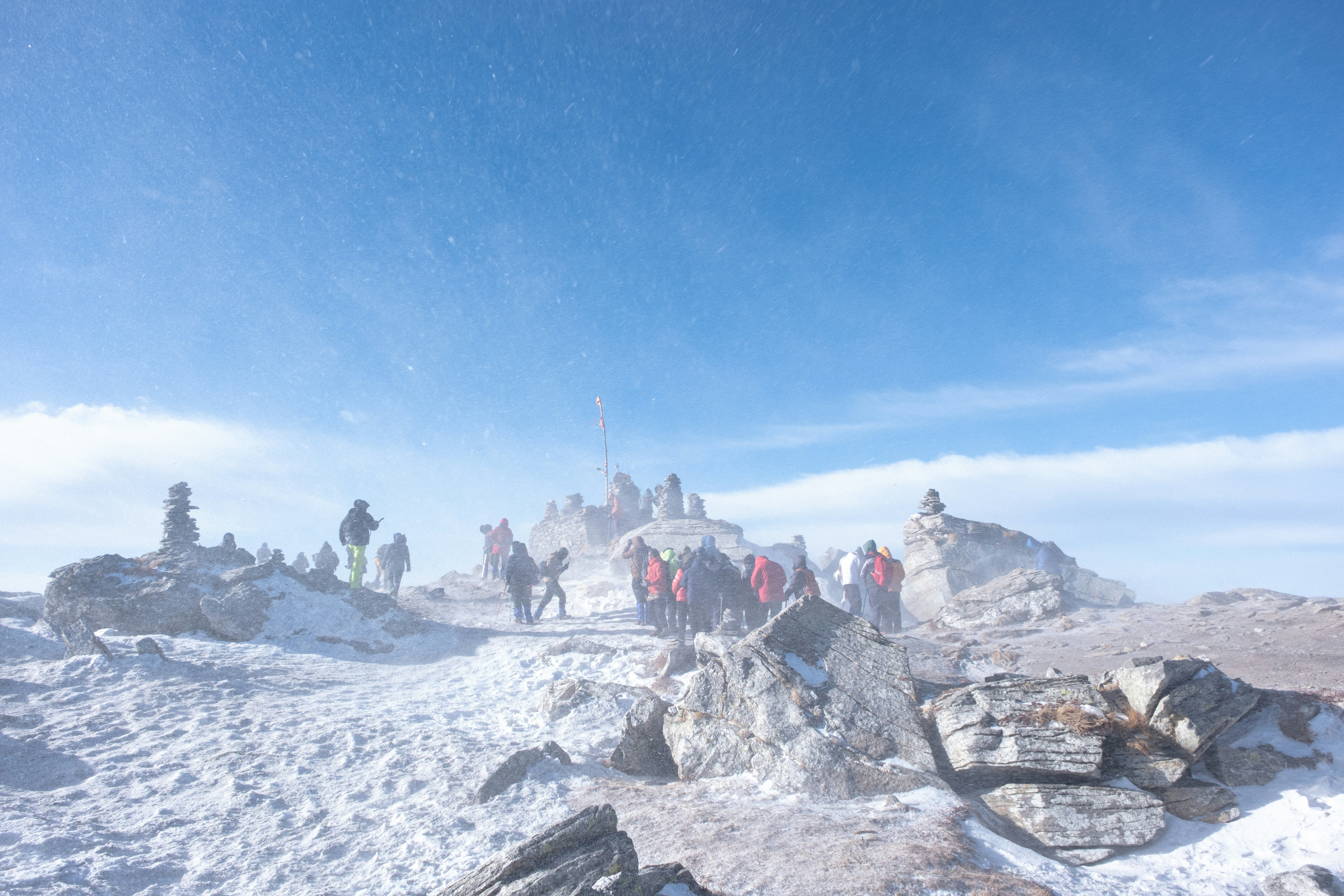 Group of travelers on mountain summit