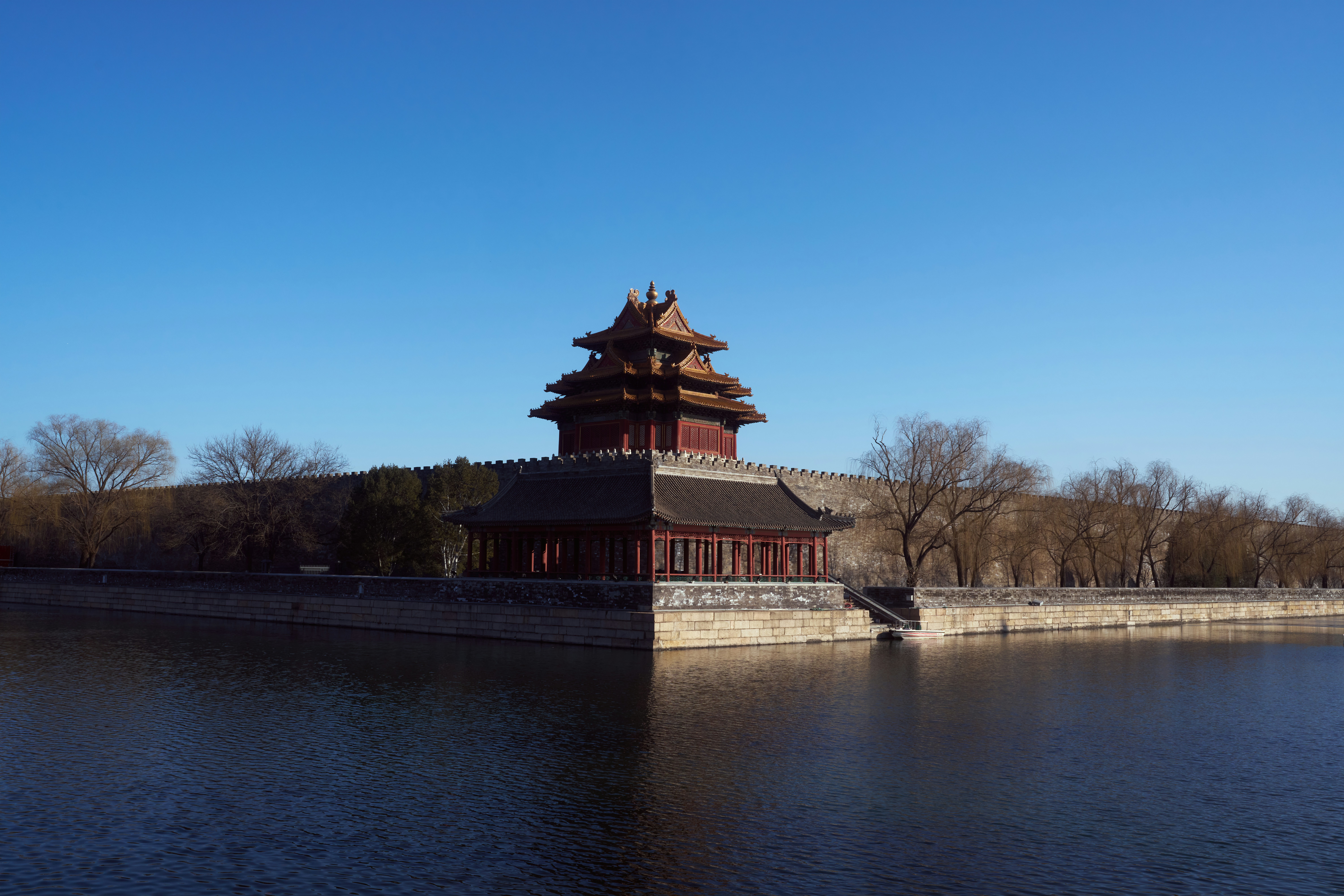 A large body of water next to a tall building