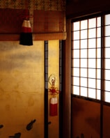 A room with a door and some birds on the wall
