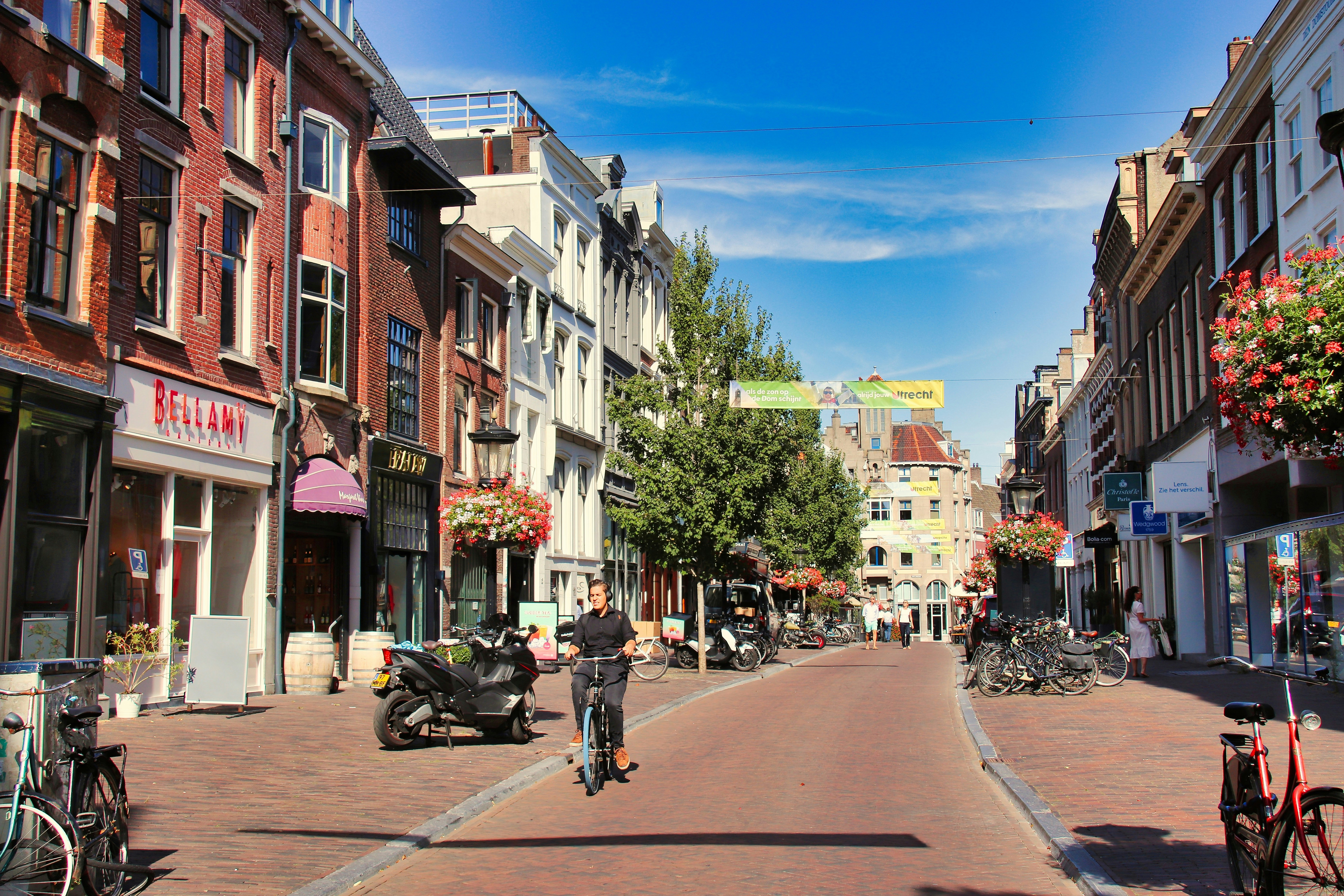 A street scene with a person riding a motorcycle