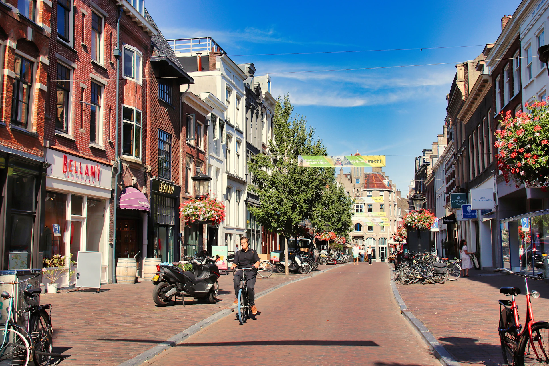 A street scene with a person riding a motorcycle