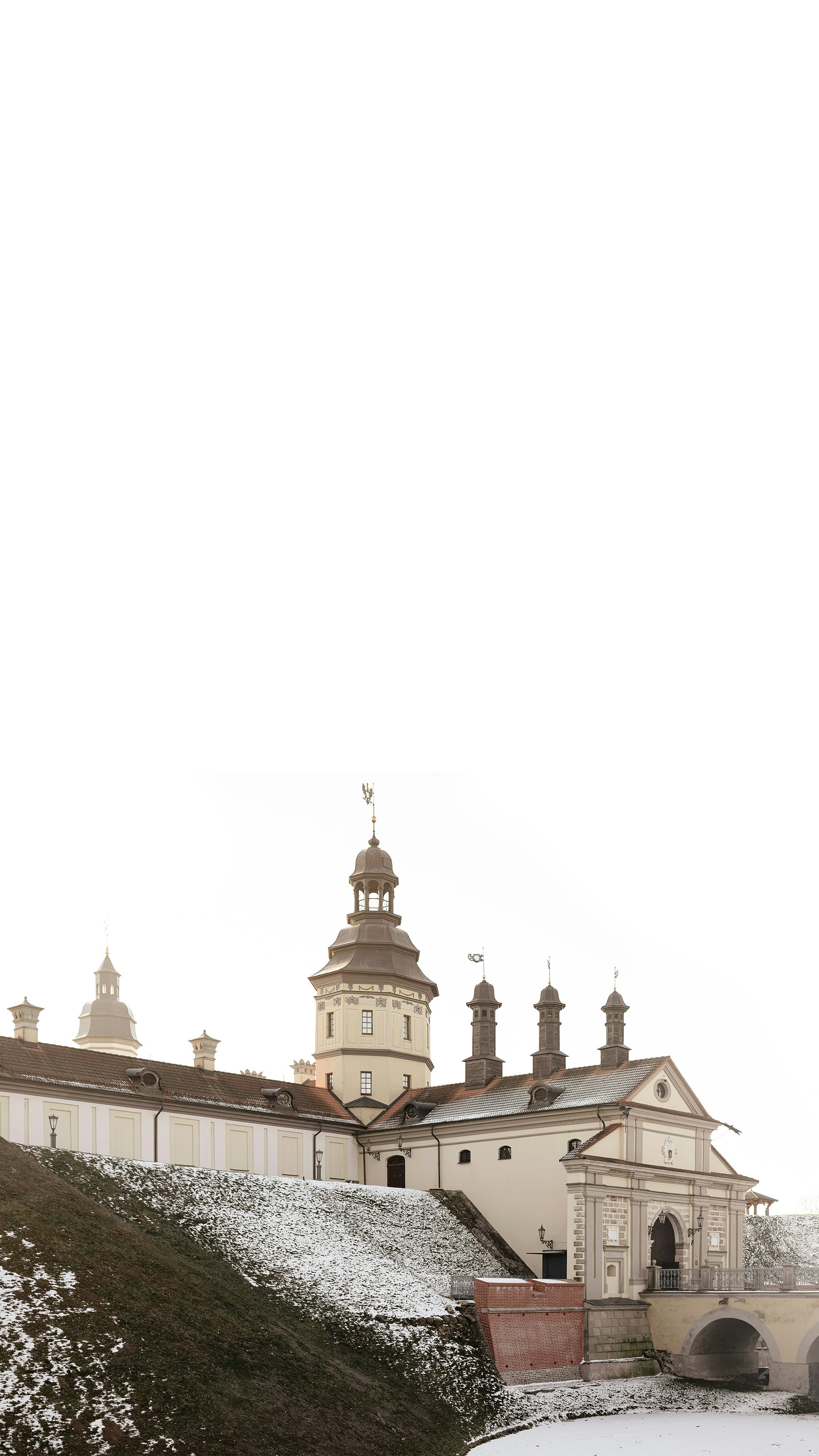 A large building with a clock tower on top of it photo – Free Wallpaper ...