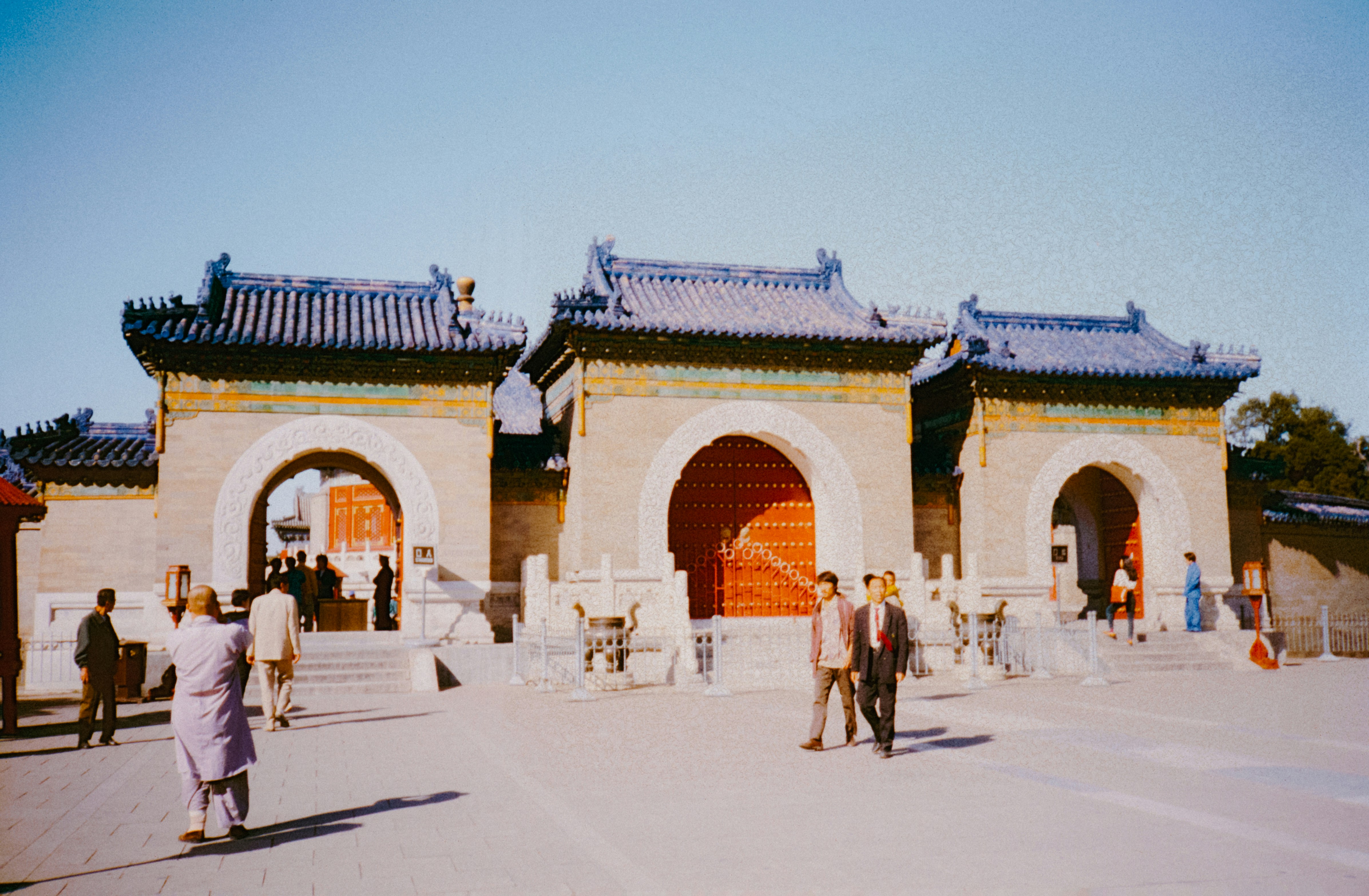 A group of people standing in front of a building