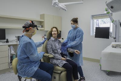A group of people in a dental room