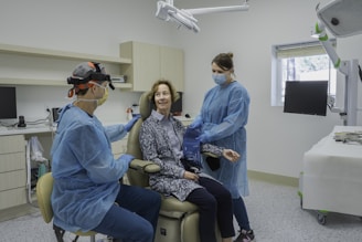 A group of people in a dental room