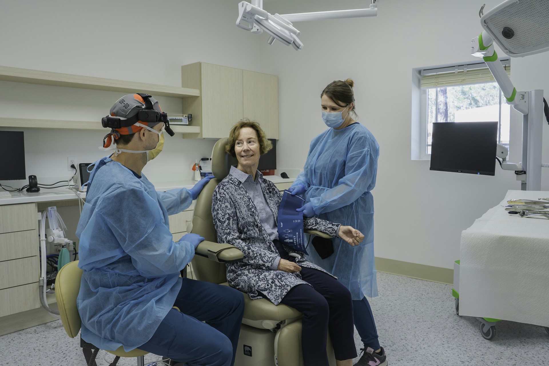 A group of people in a dental room