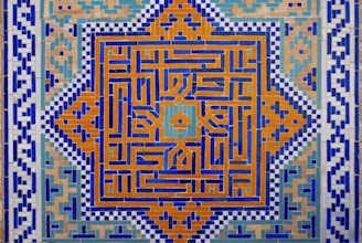 A painting of a blue and orange design on a wall