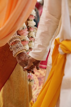 A close up of a person holding hands with another person