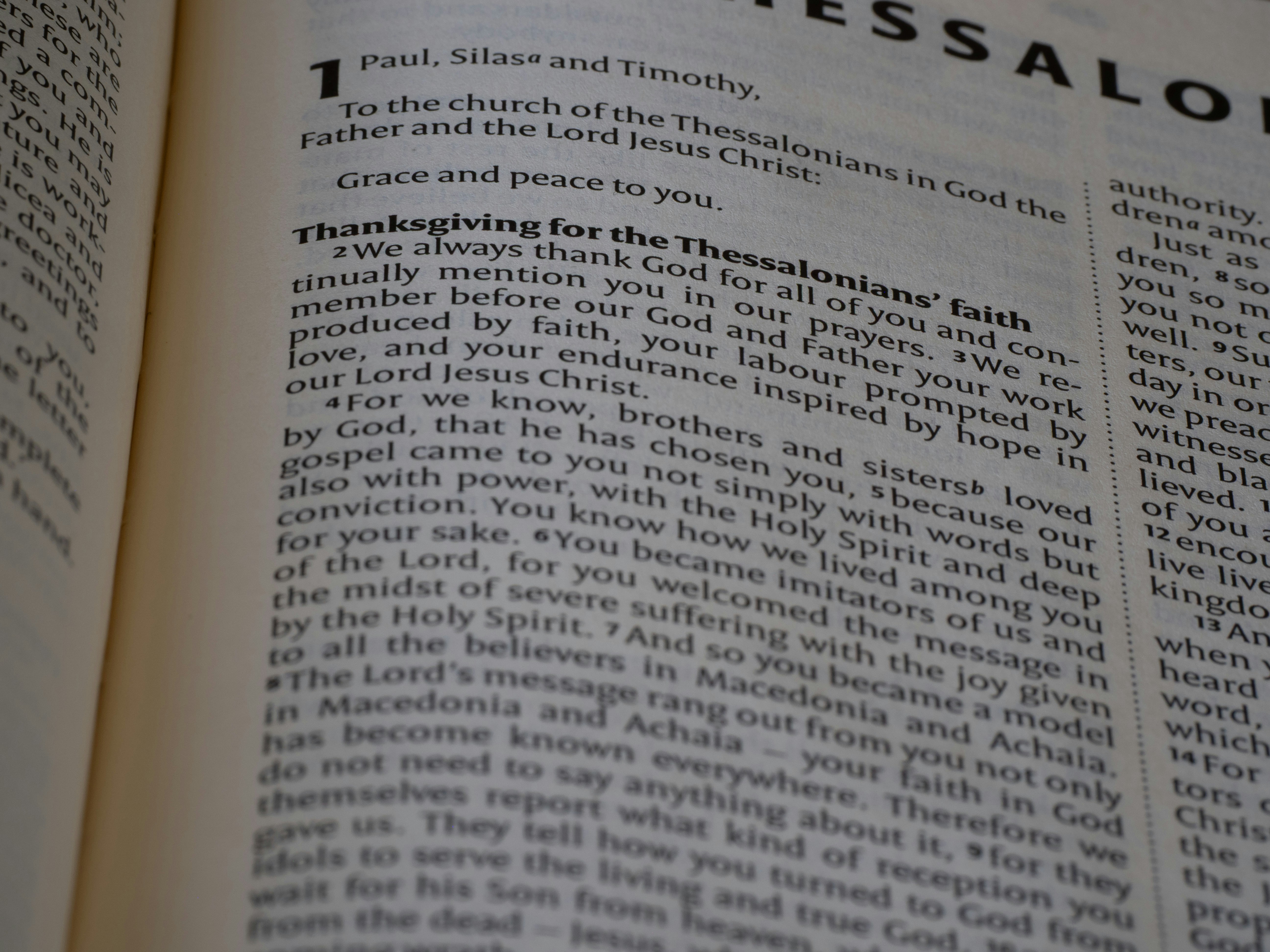 A close up of an open book with writing on it