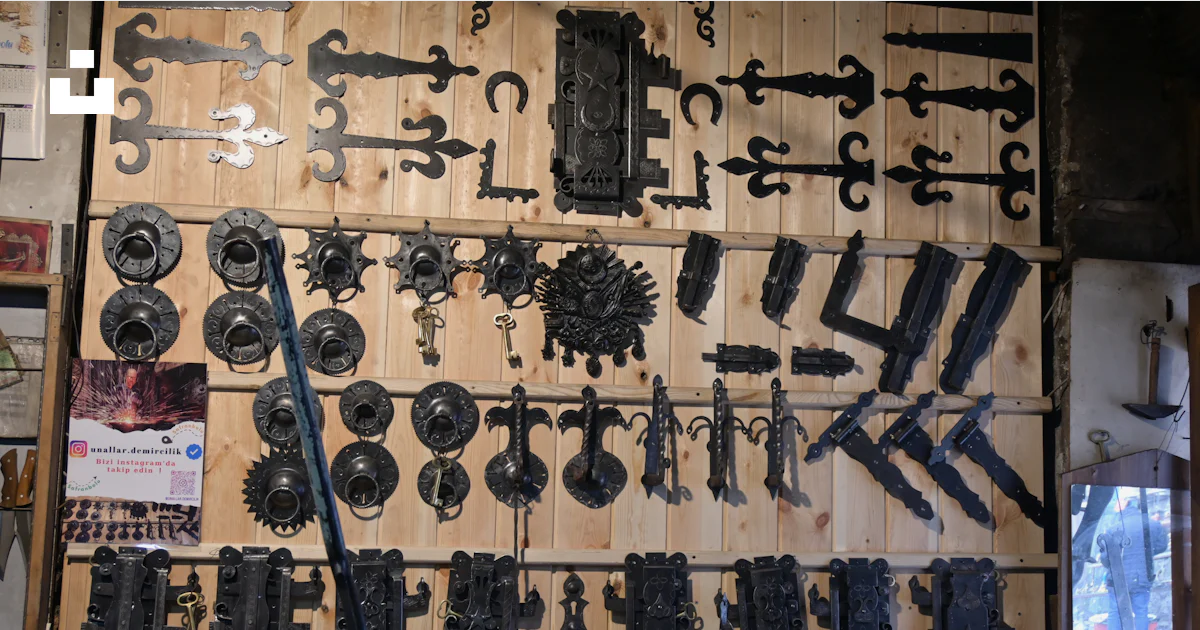 A bunch of tools are hanging on a wall photo – Free Coppersmith bazaar ...