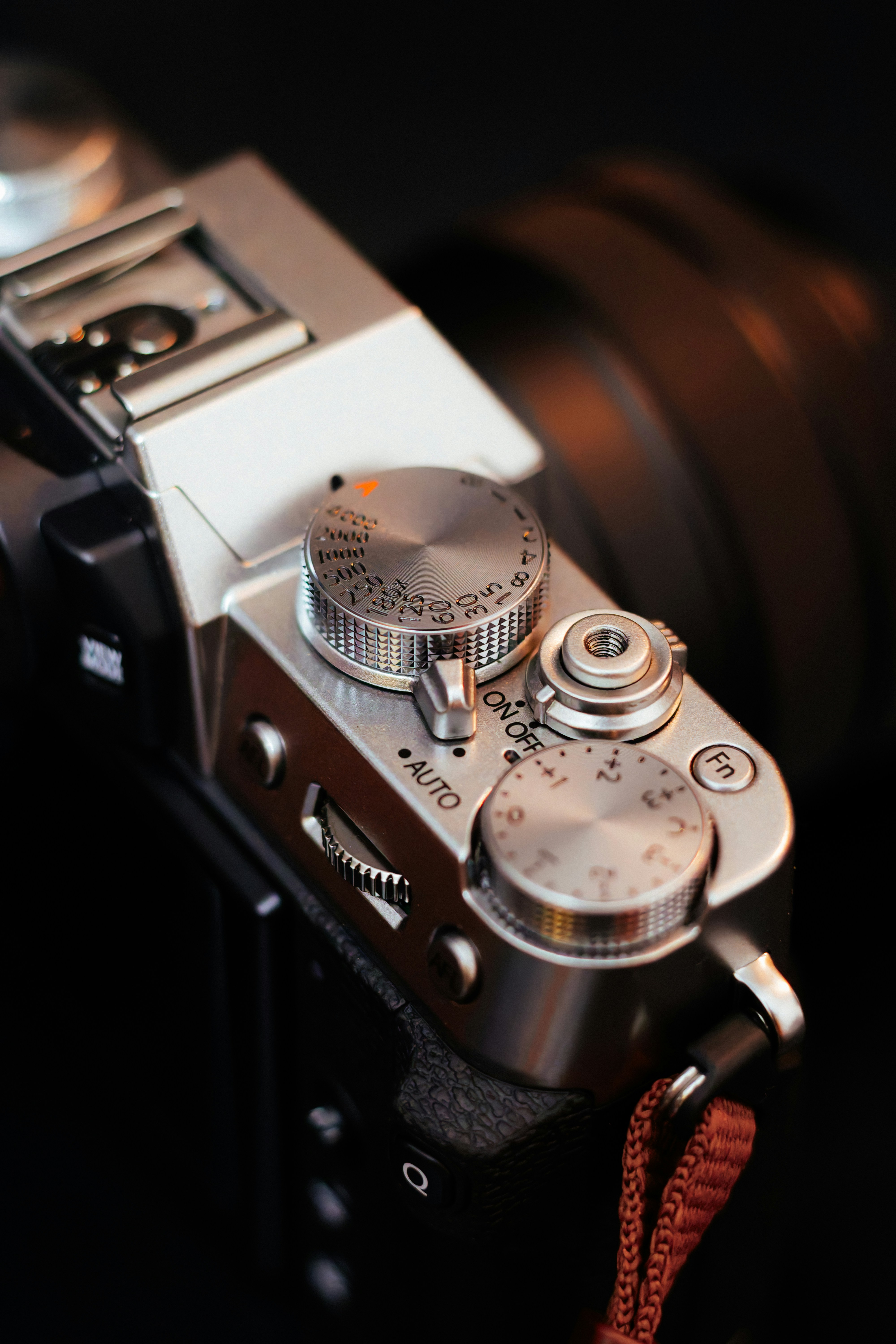 A close up of a camera on a black background