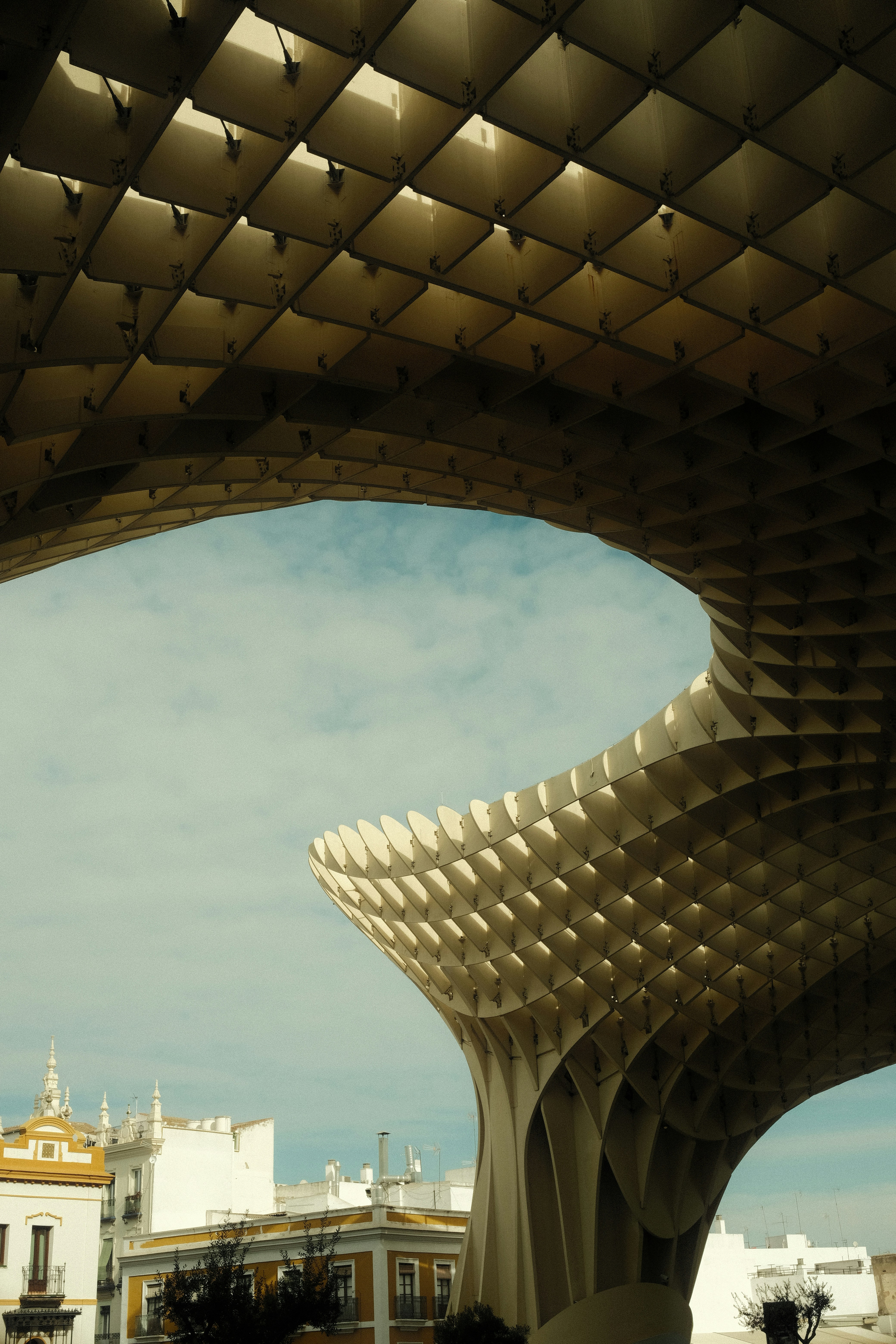 A view of a building from under a bridge