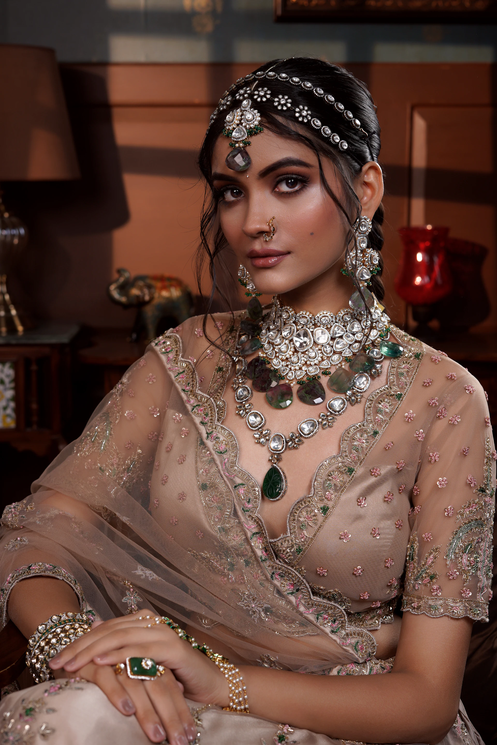 Close-up of a bride in blush lehenga with maang tikka