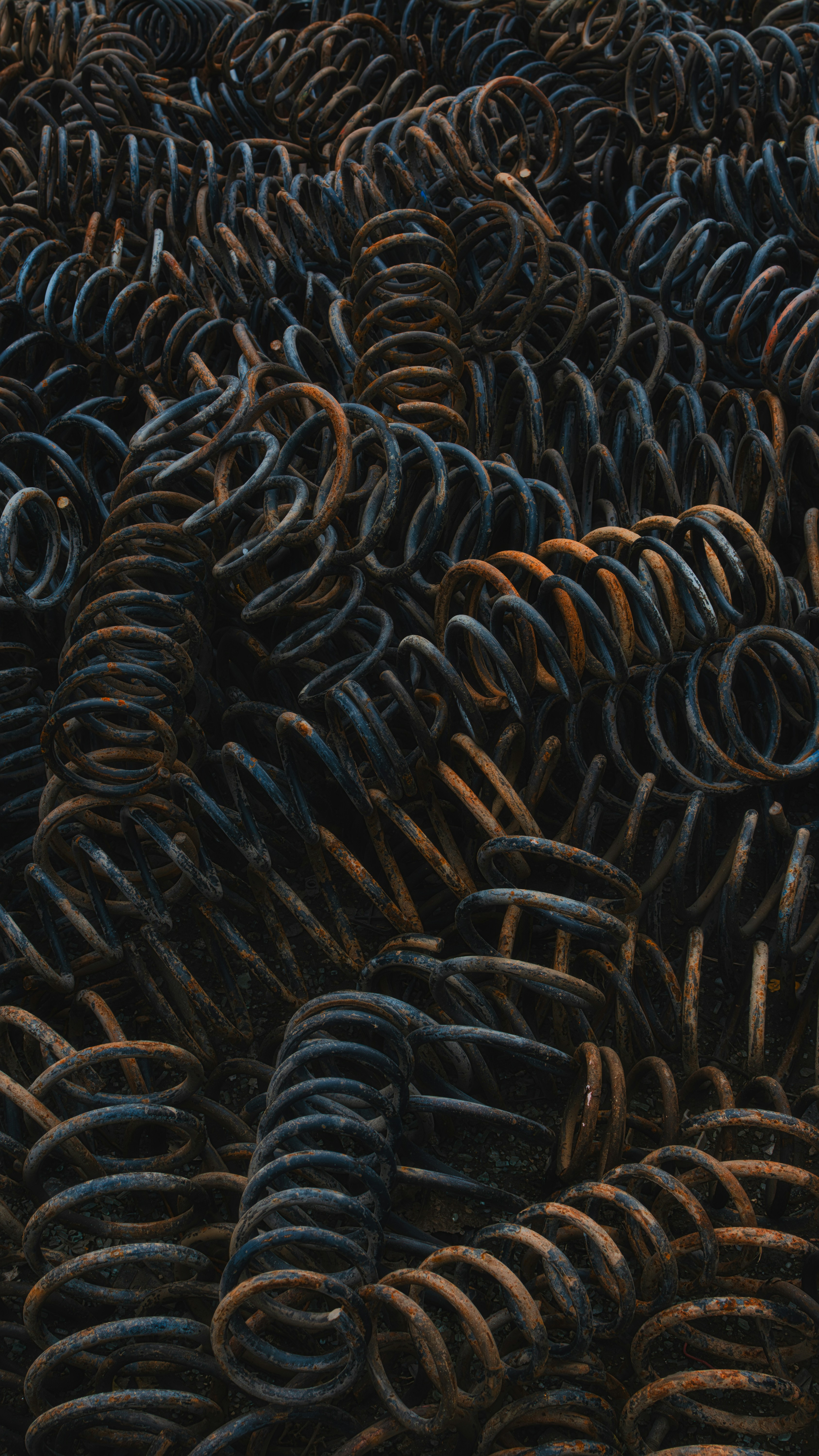 A large group of metal rings stacked on top of each other