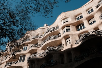 A tall building with many windows and balconies