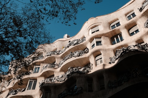 A tall building with many windows and balconies