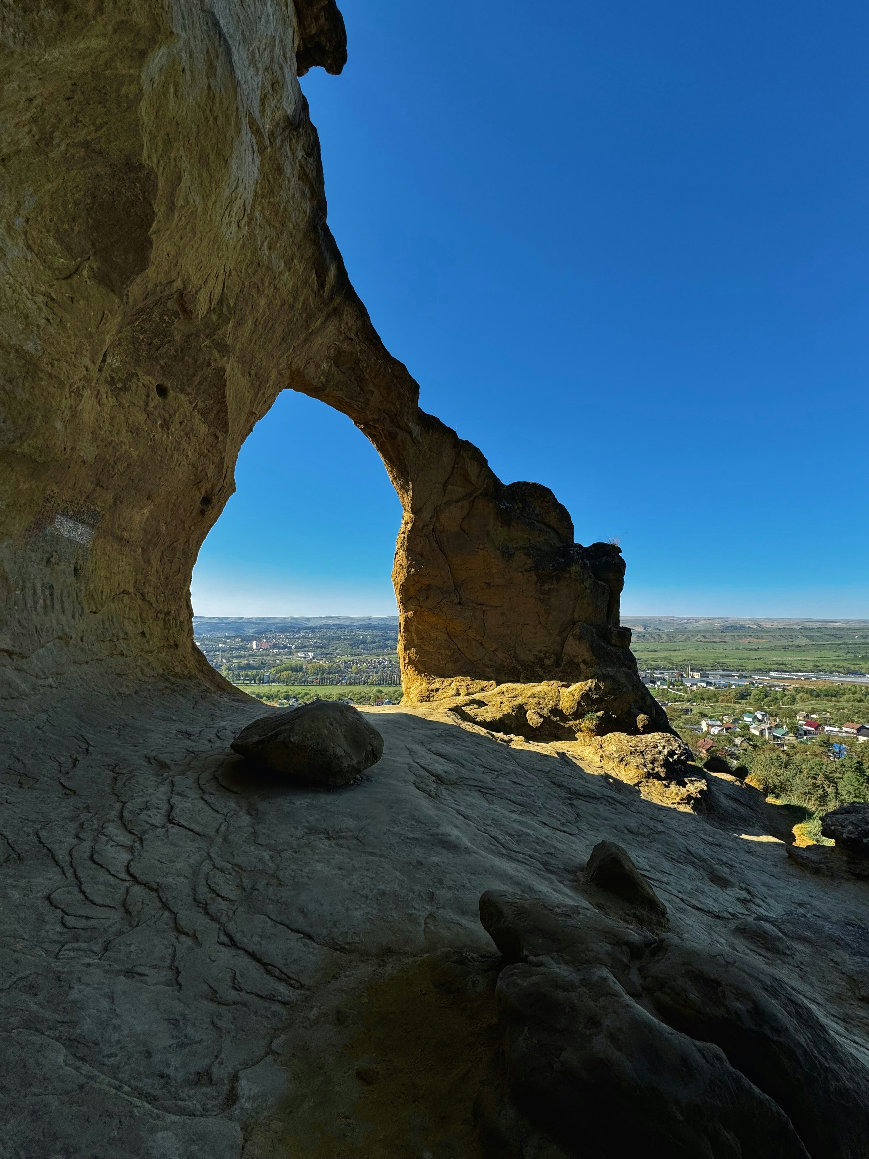 A rock formation with a view of the valley below