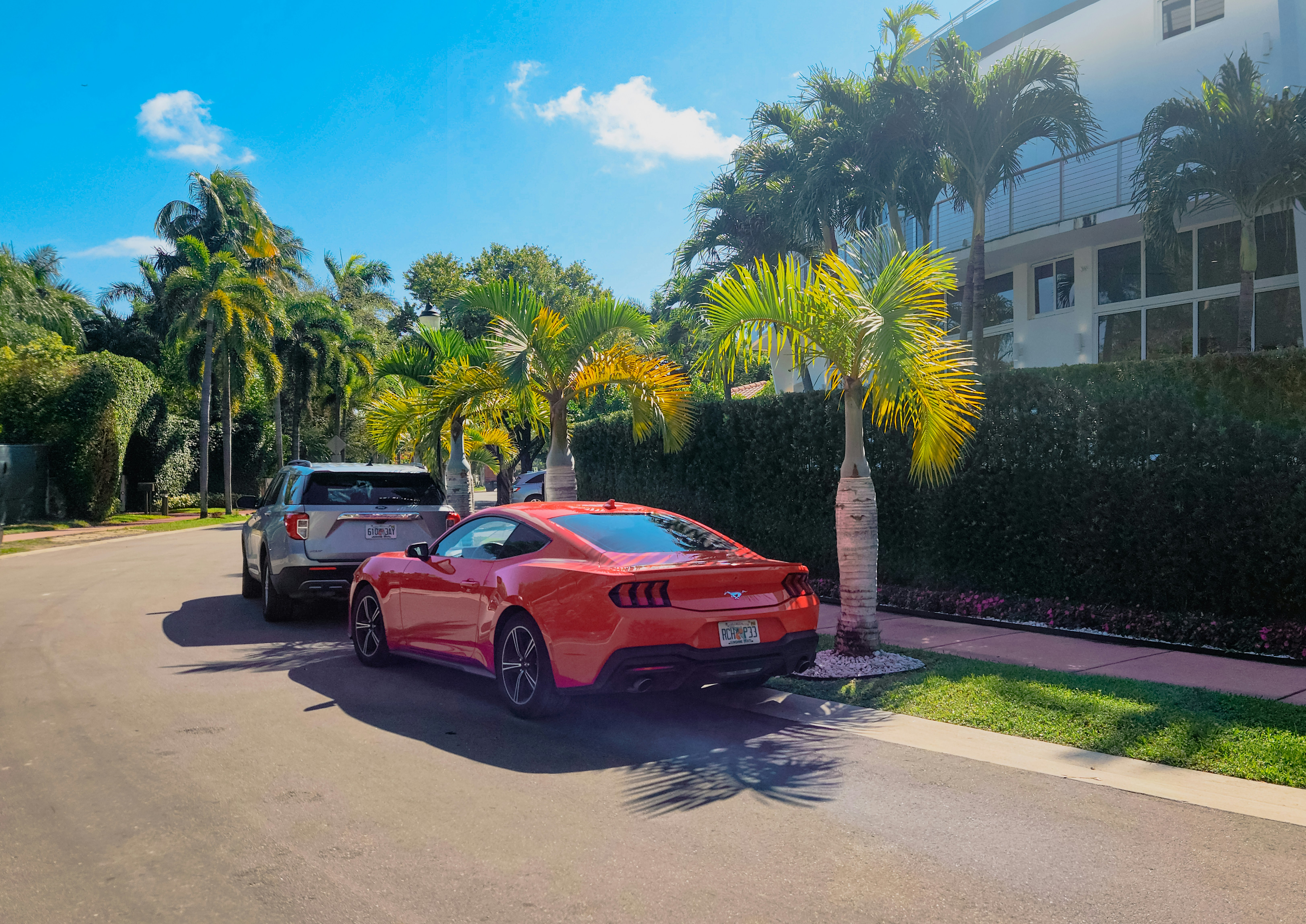 A red sports car parked in front of a house photo – Free Venetian ...