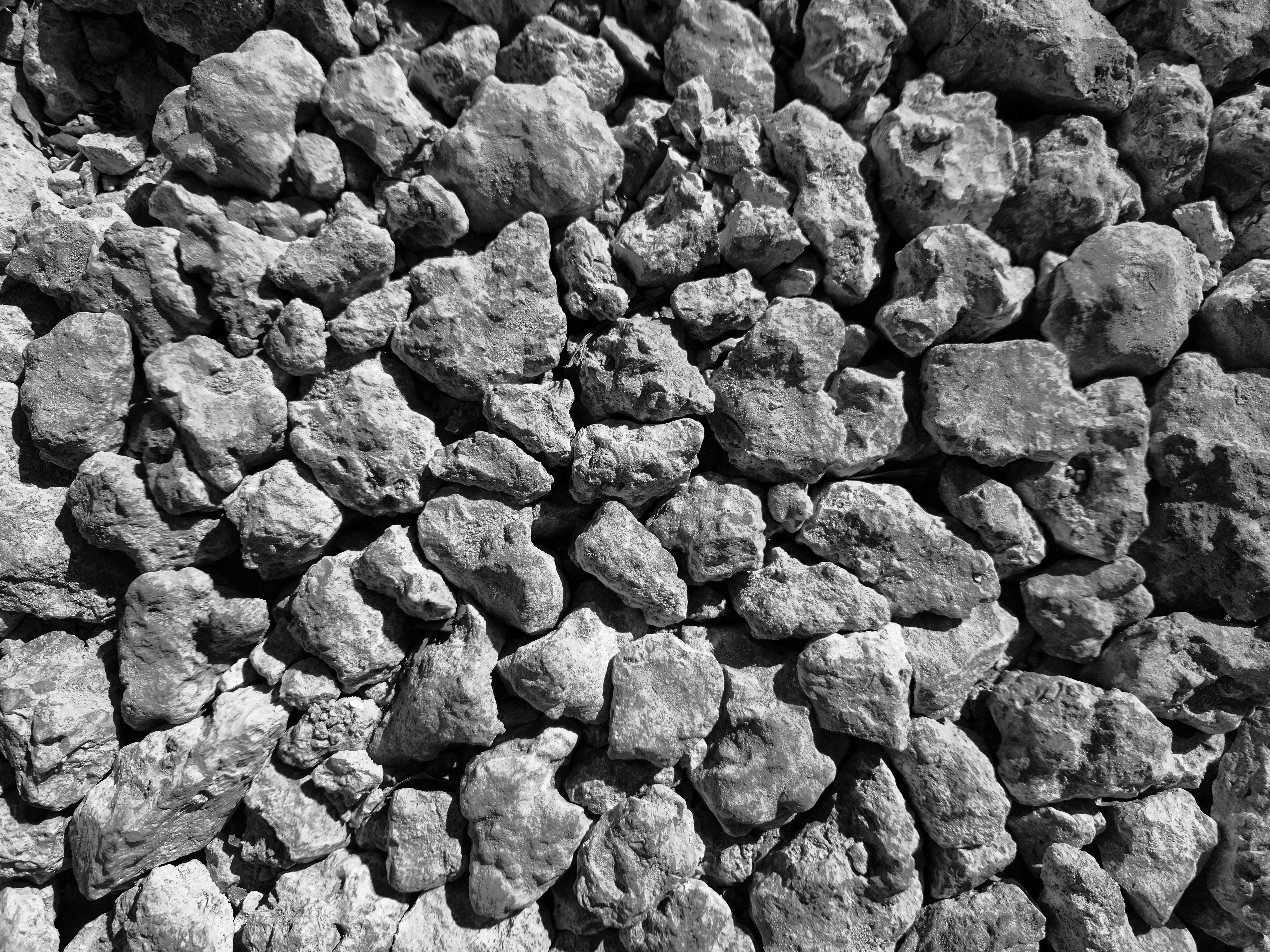 A black and white photo of a pile of rocks