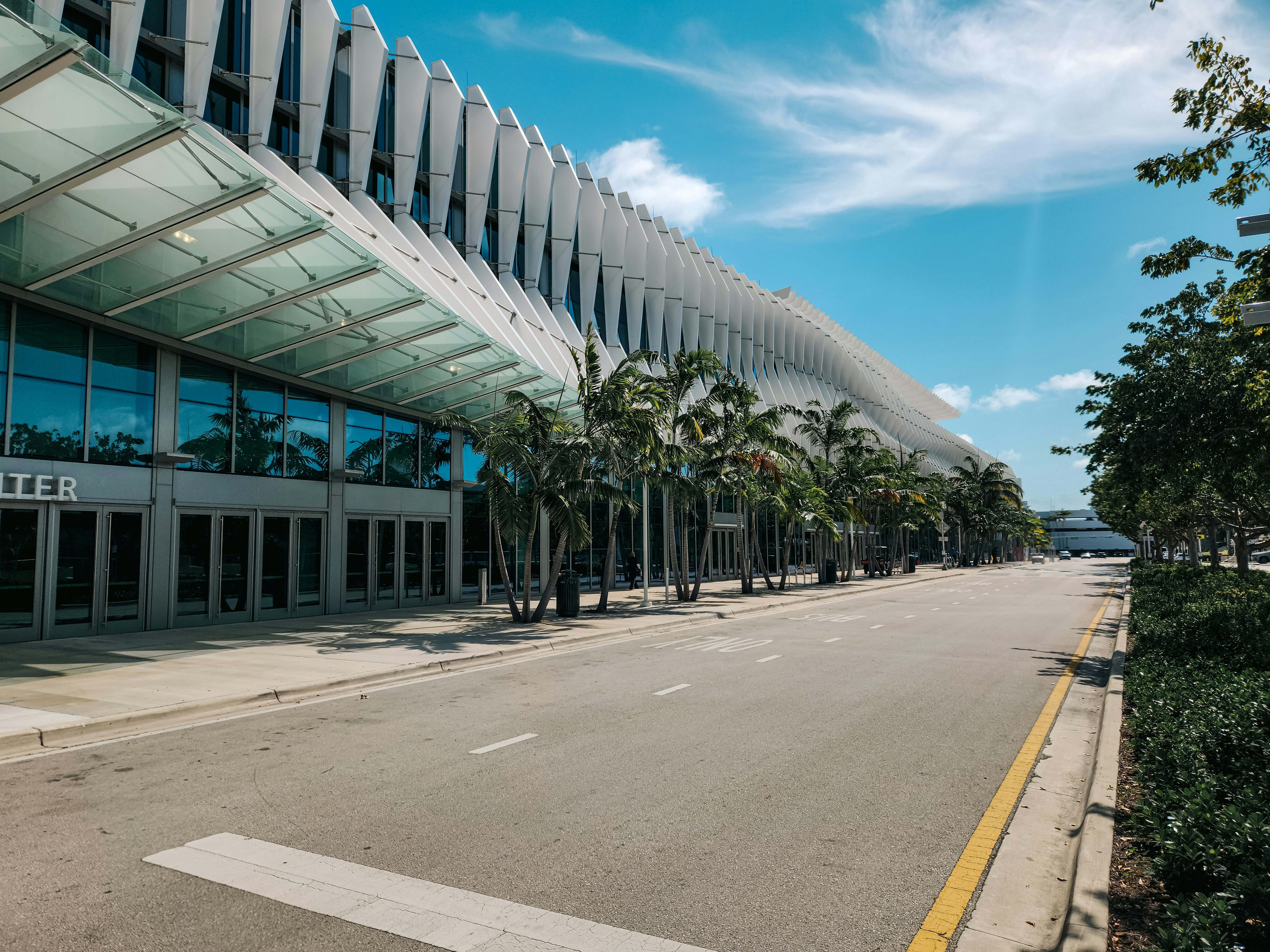 An empty street in front of a large building