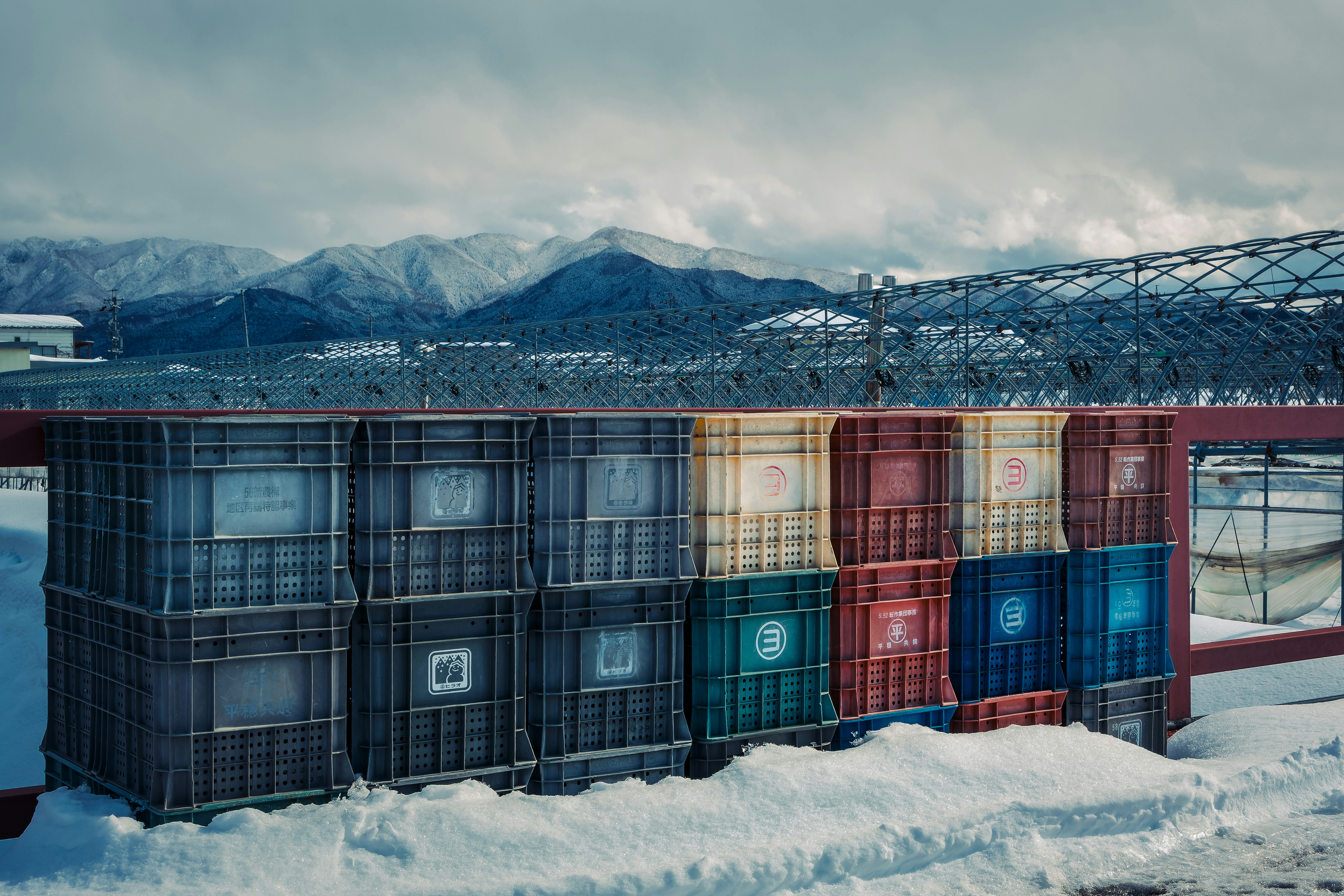 A building made out of shipping containers in the snow