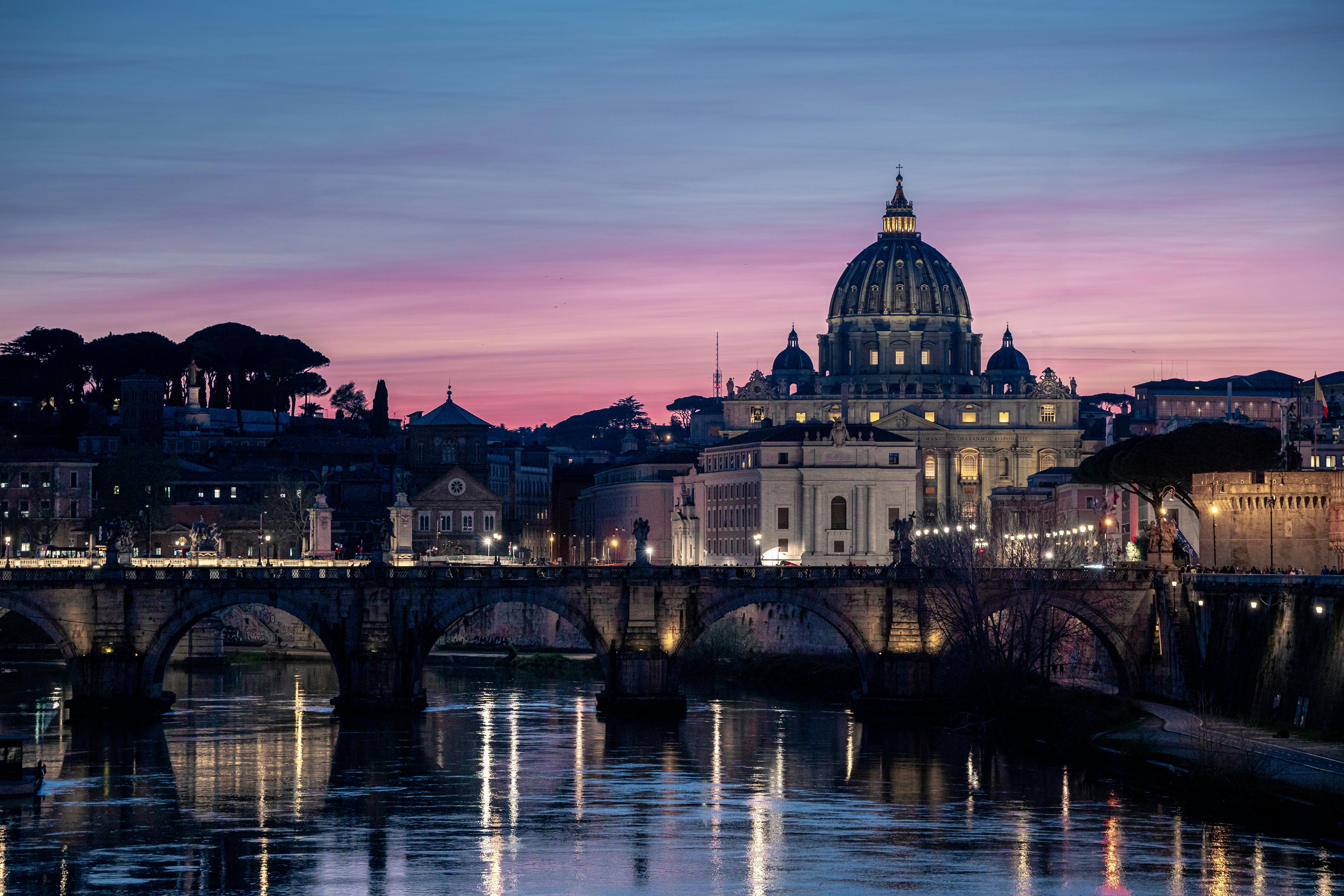 A view of a city with a bridge in the foreground