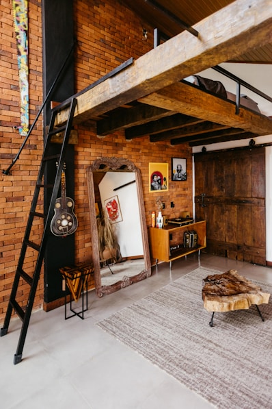 A loft with a loft bed and a ladder