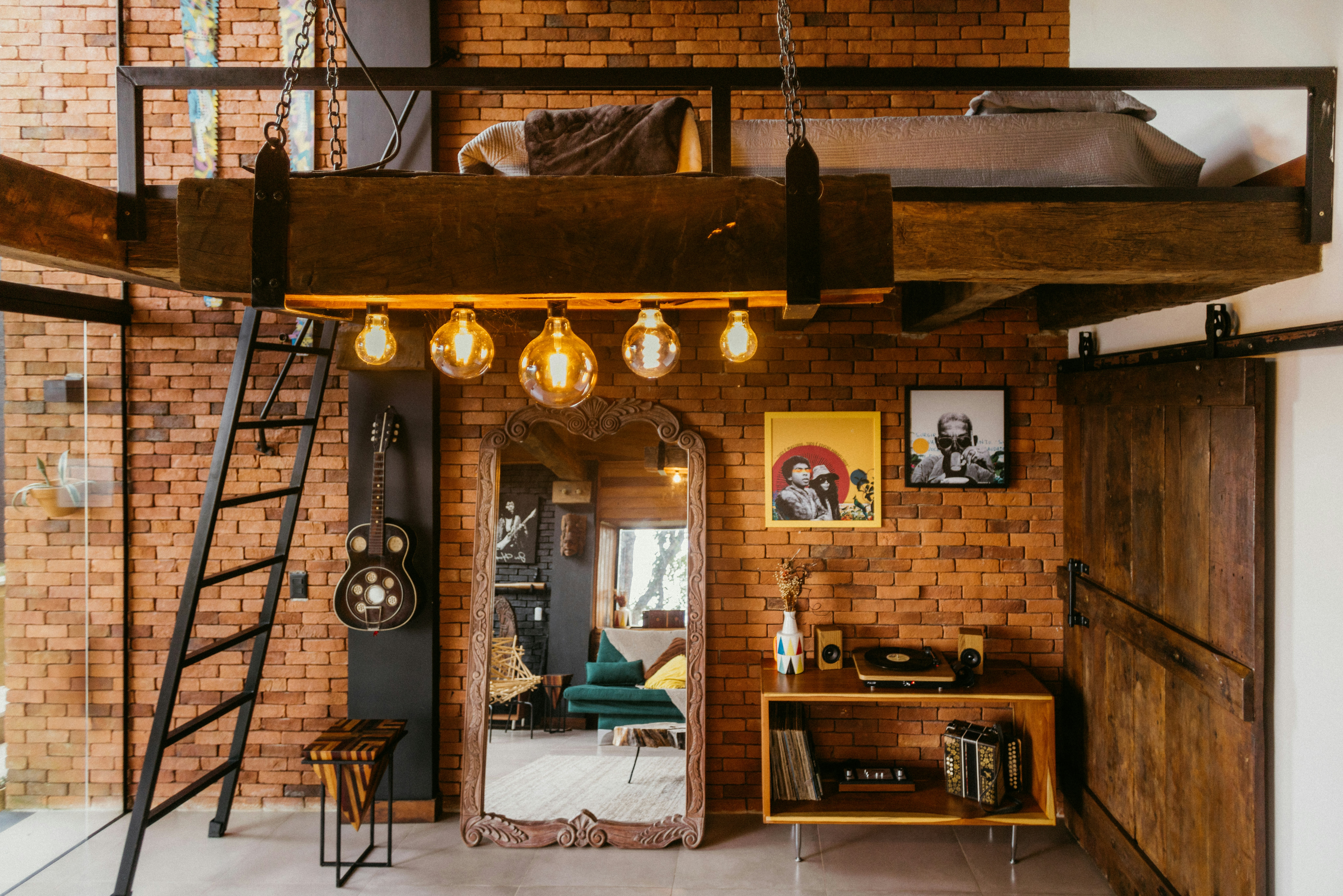 A loft with a loft bed and loft stairs