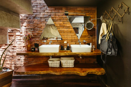 A bathroom with two sinks and a mirror