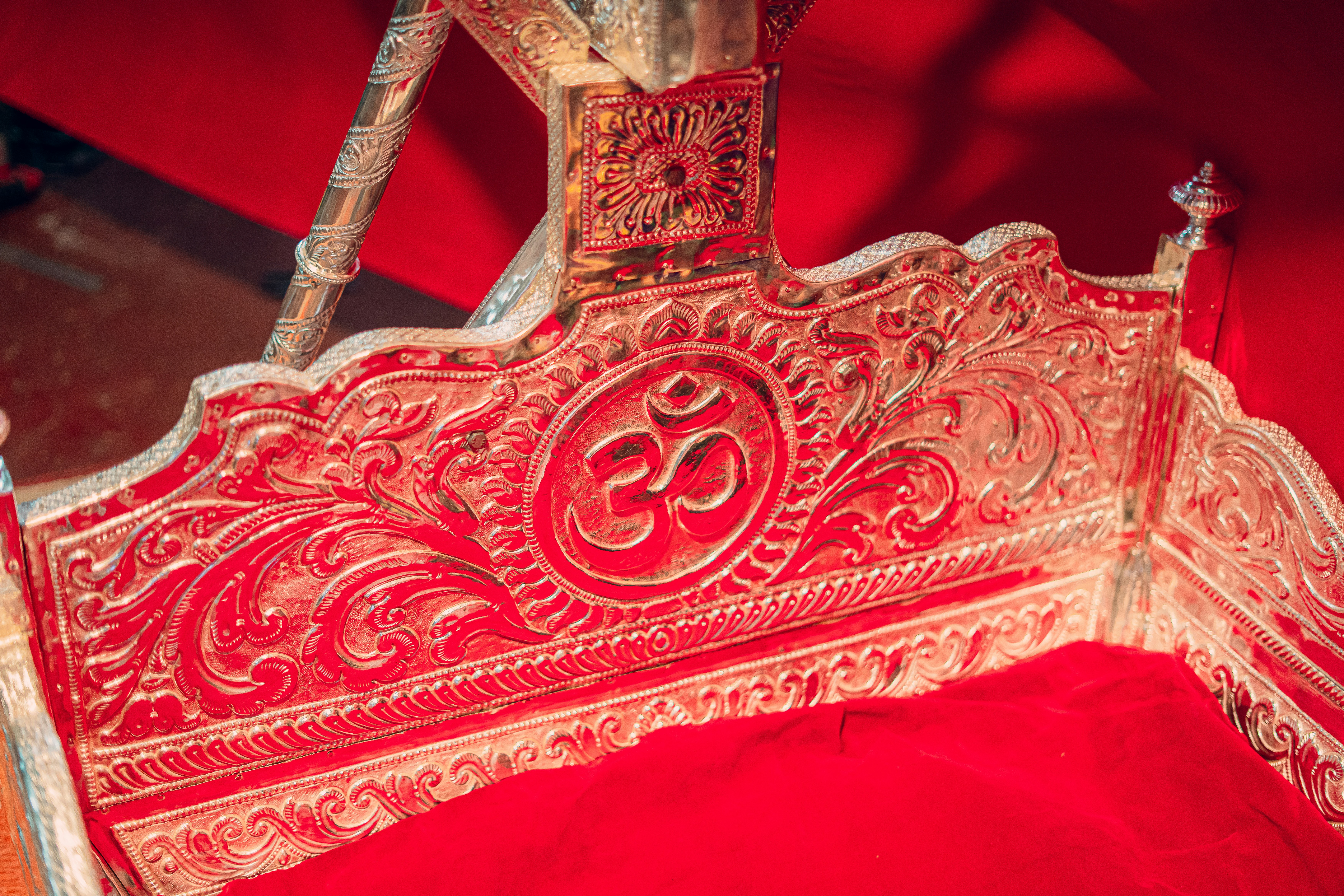 A statue of a woman sitting on a red chair