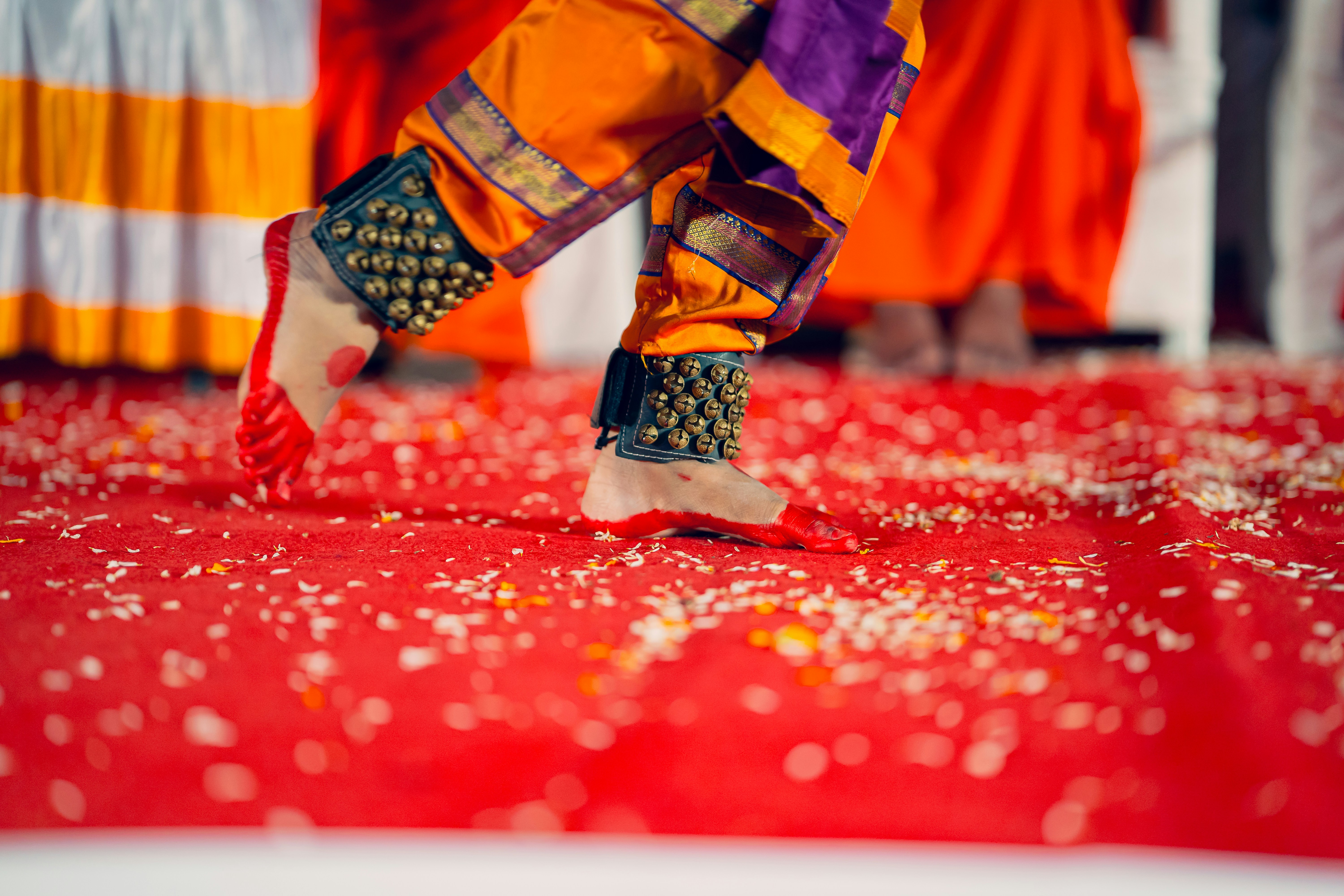 A close up of a person walking on a red carpet