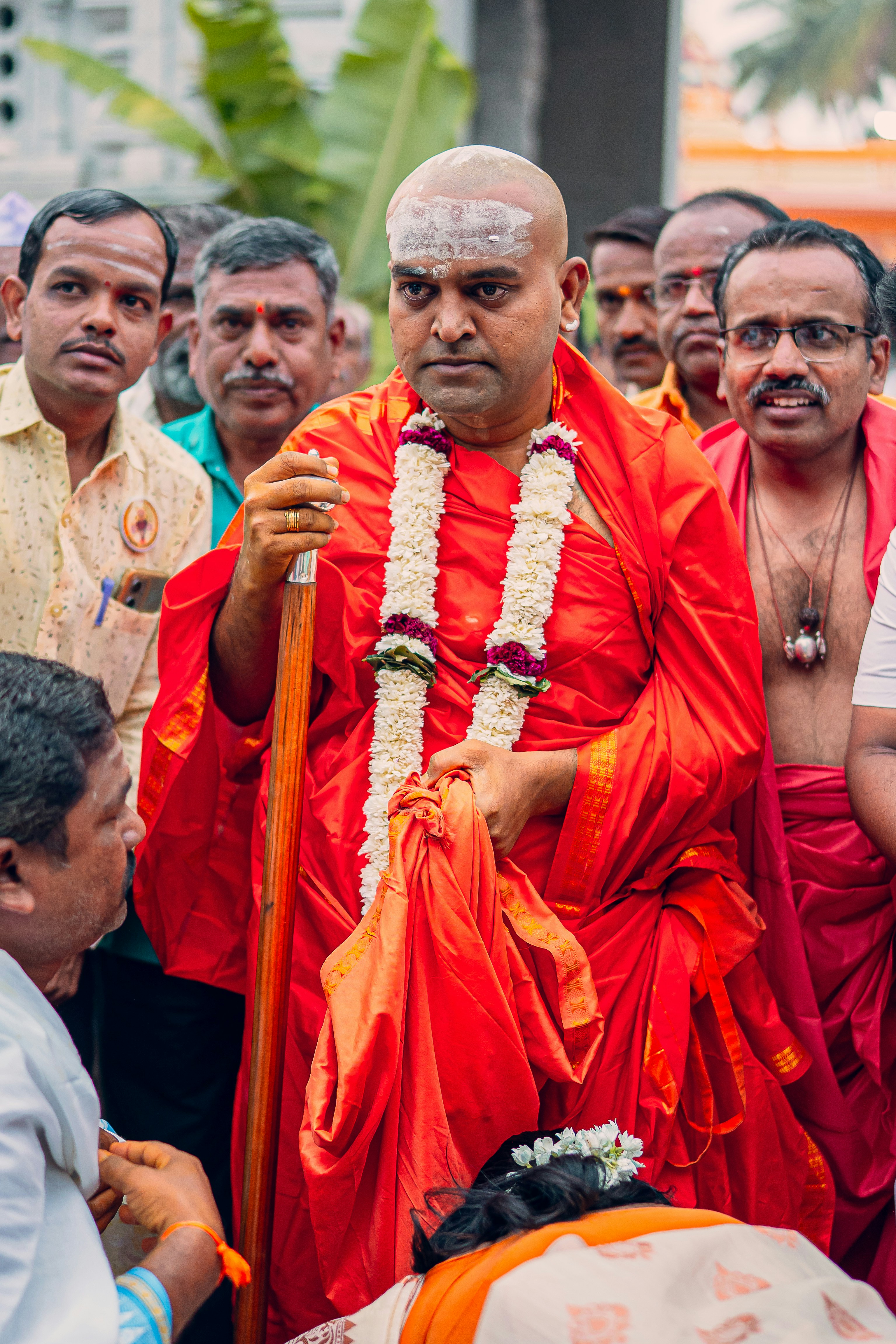 A group of men standing around each other