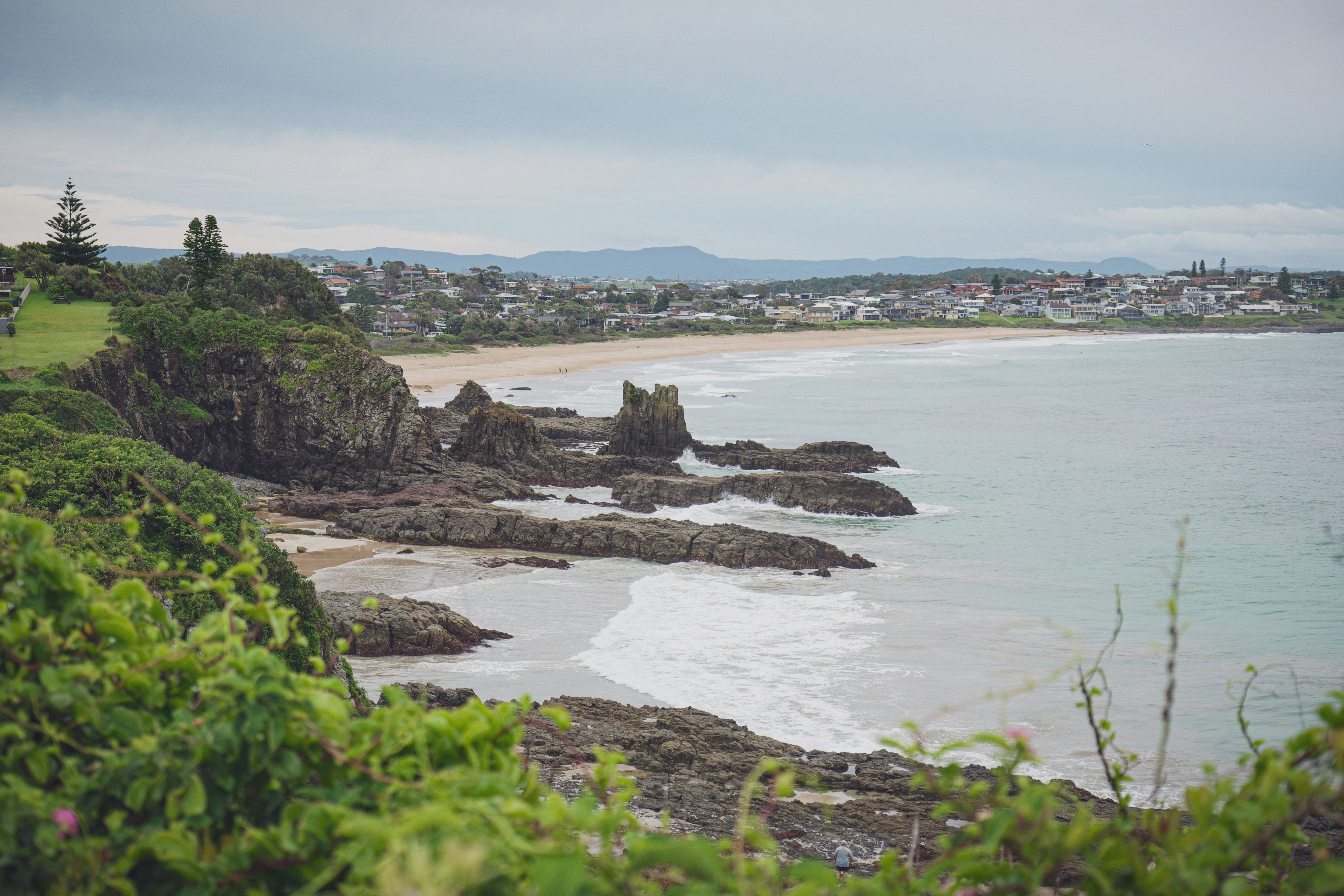 A scenic view of a beach and the ocean