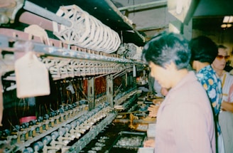 A group of people standing in front of a machine