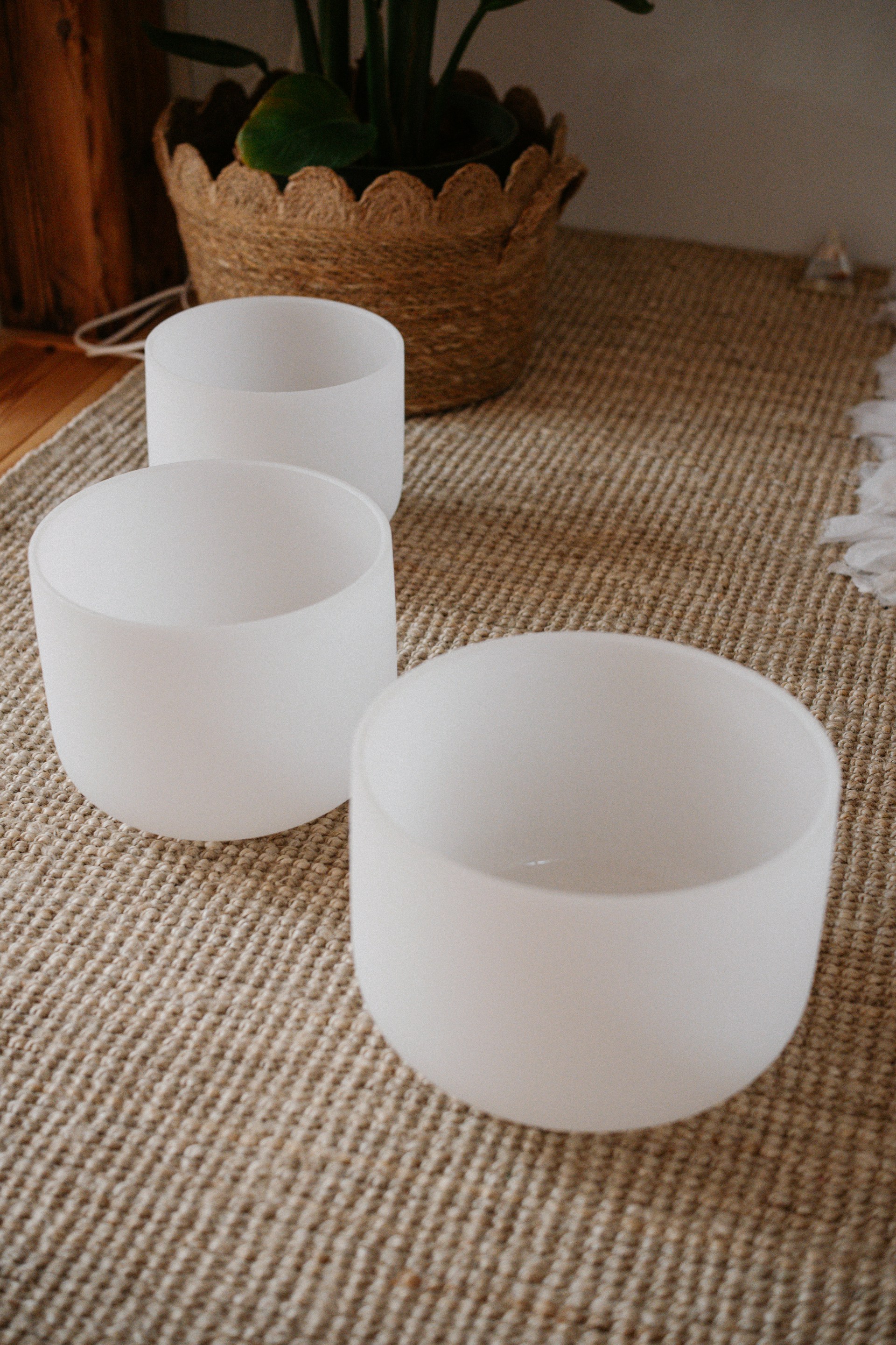 Three white bowls sitting on top of a table