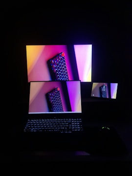 A laptop computer sitting on top of a desk