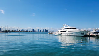 A large white boat floating on top of a body of water