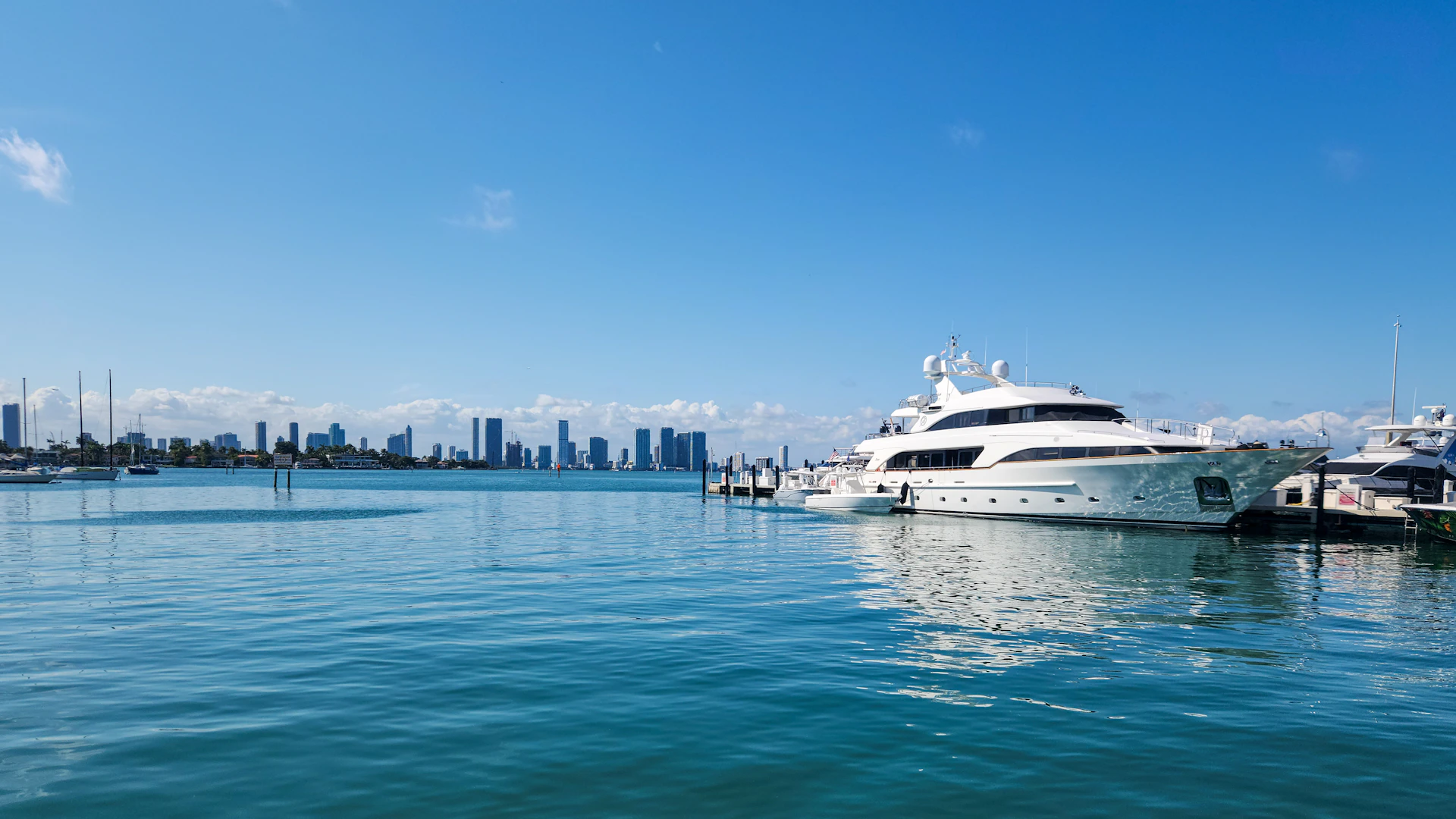 A large white boat floating on top of a body of water