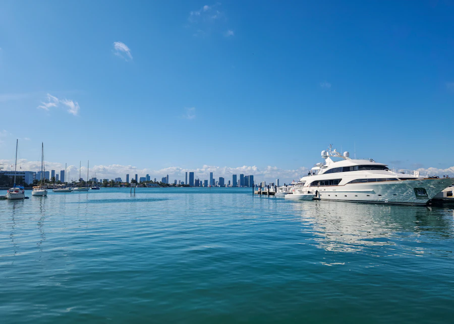 A white yacht moored at Sunset Harbour, Miami Beach, with the skyline behind
