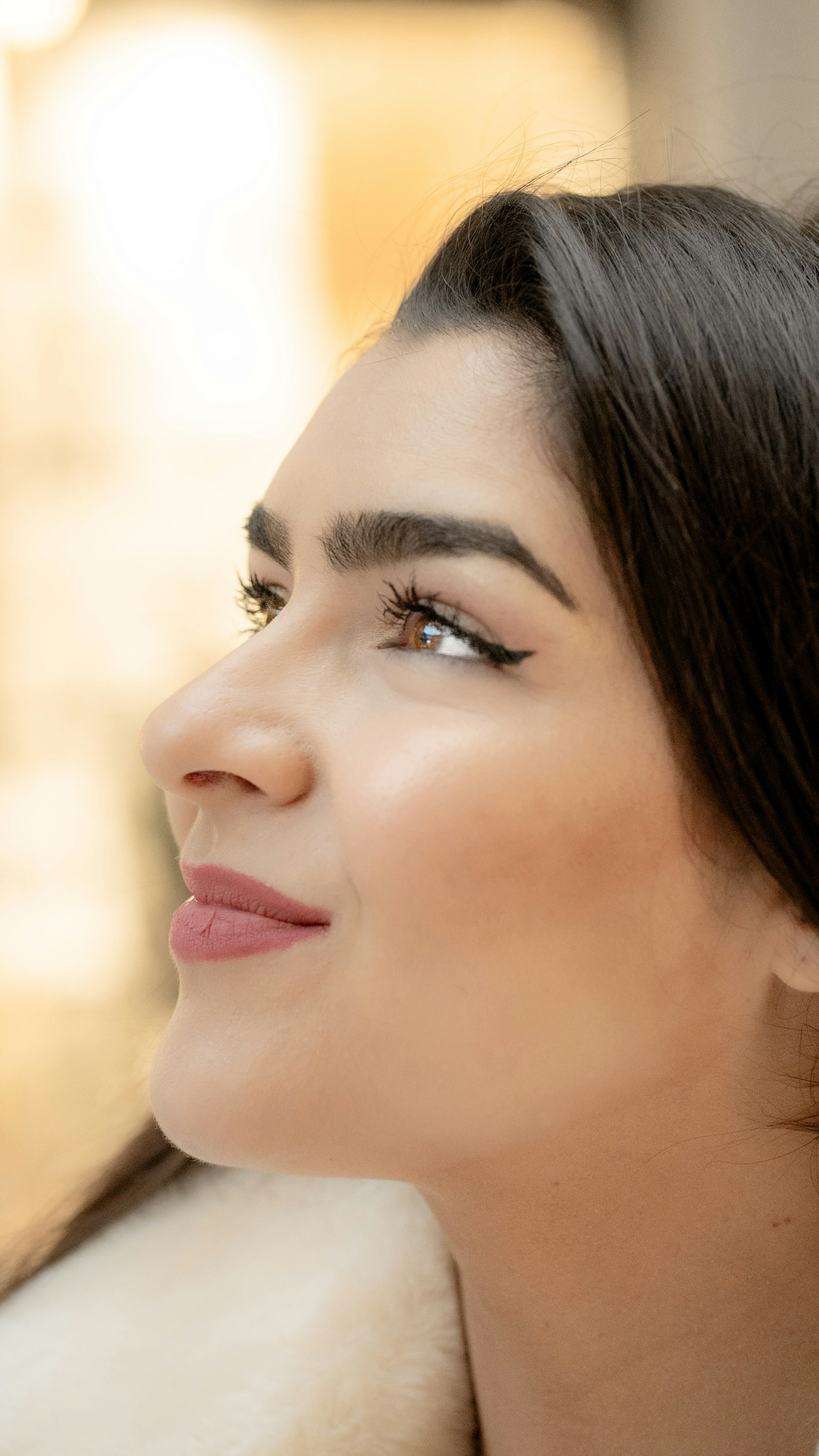 A woman in a fur coat looking off into the distance