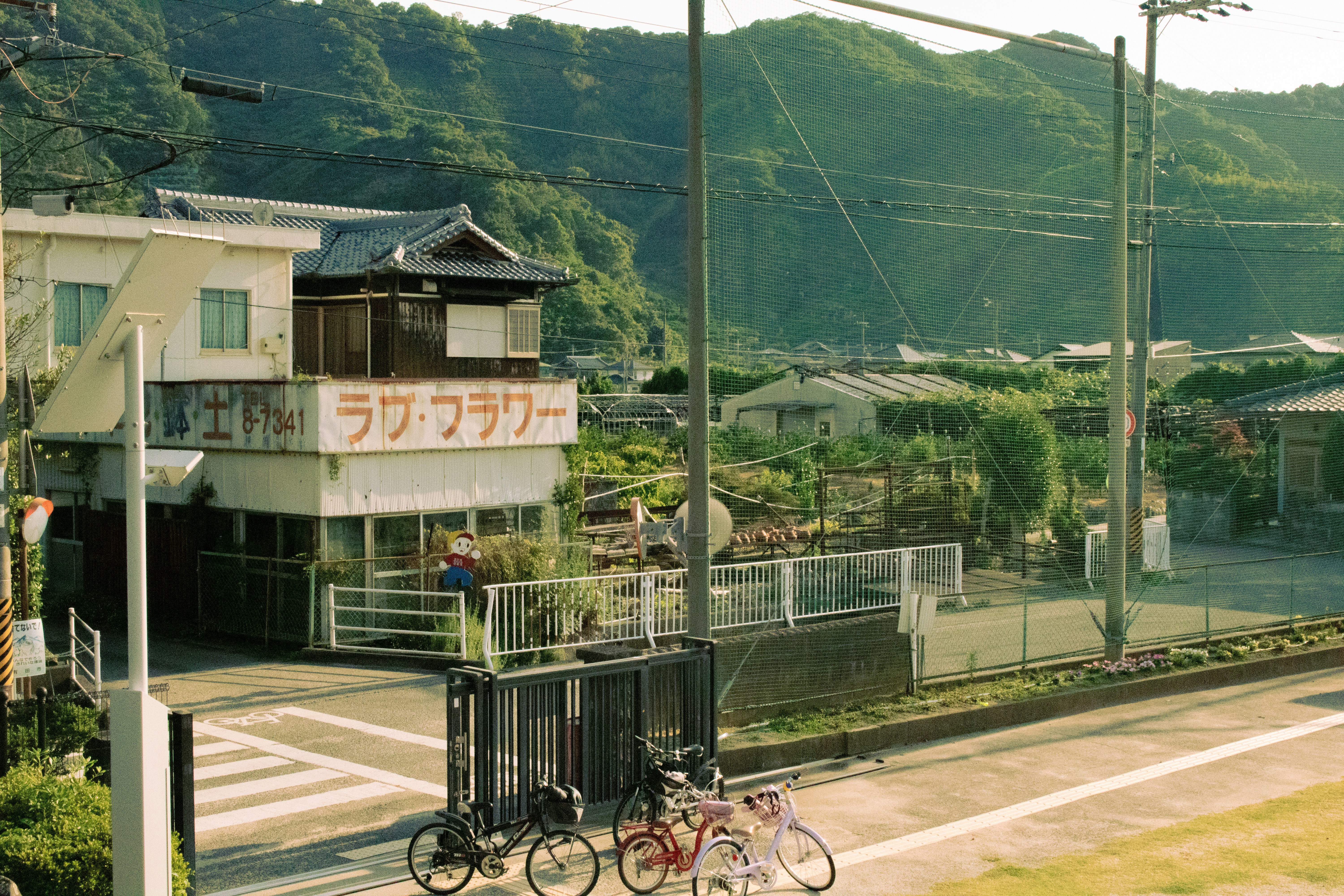 A group of bikes parked on the side of a road