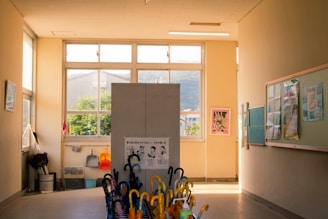 A room with a bunch of umbrellas in it