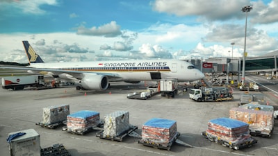 A large jetliner sitting on top of an airport tarmac