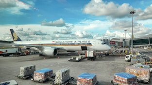 A large jetliner sitting on top of an airport tarmac
