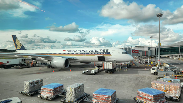 A large jetliner sitting on top of an airport tarmac
