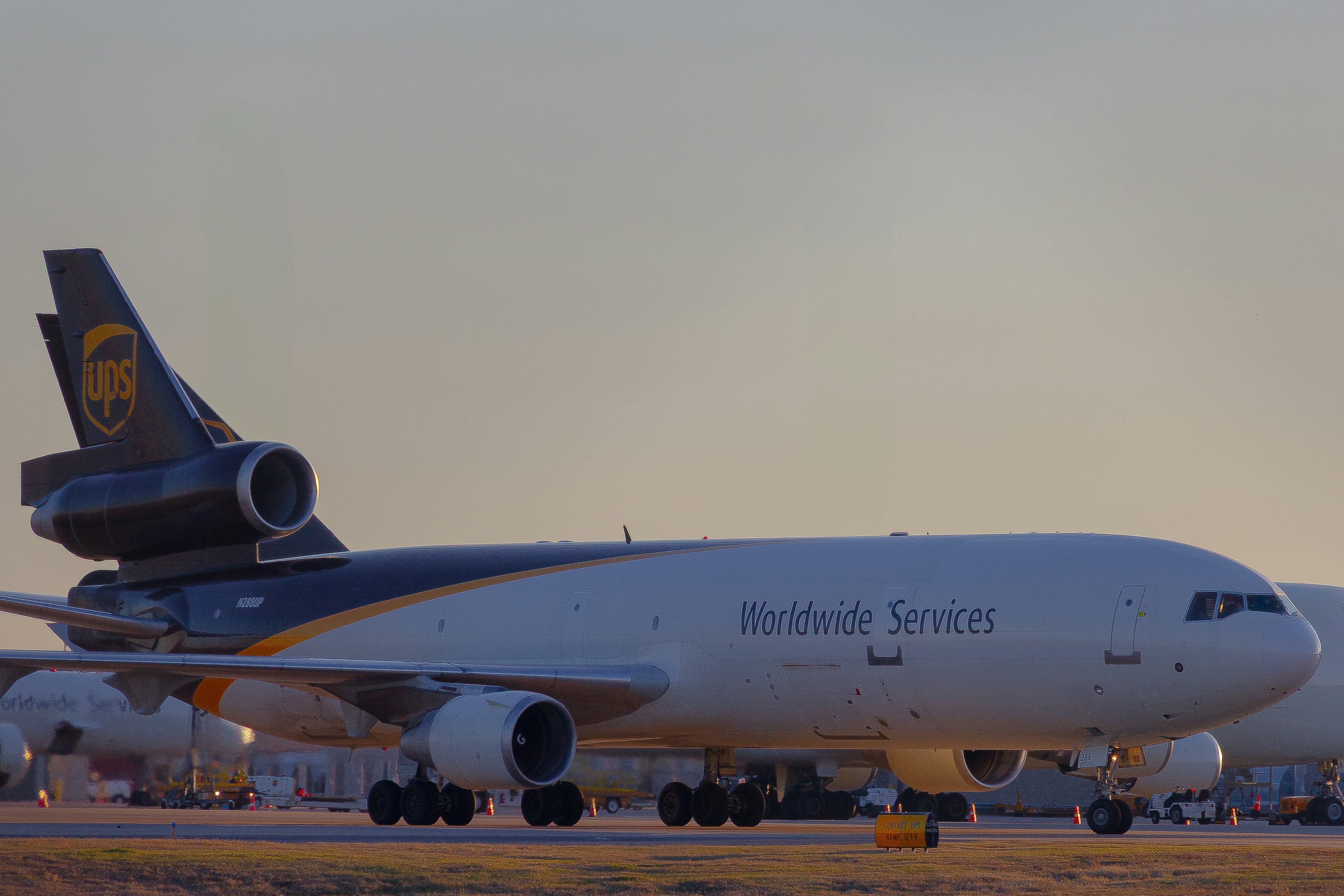 A large jetliner sitting on top of an airport runway, 