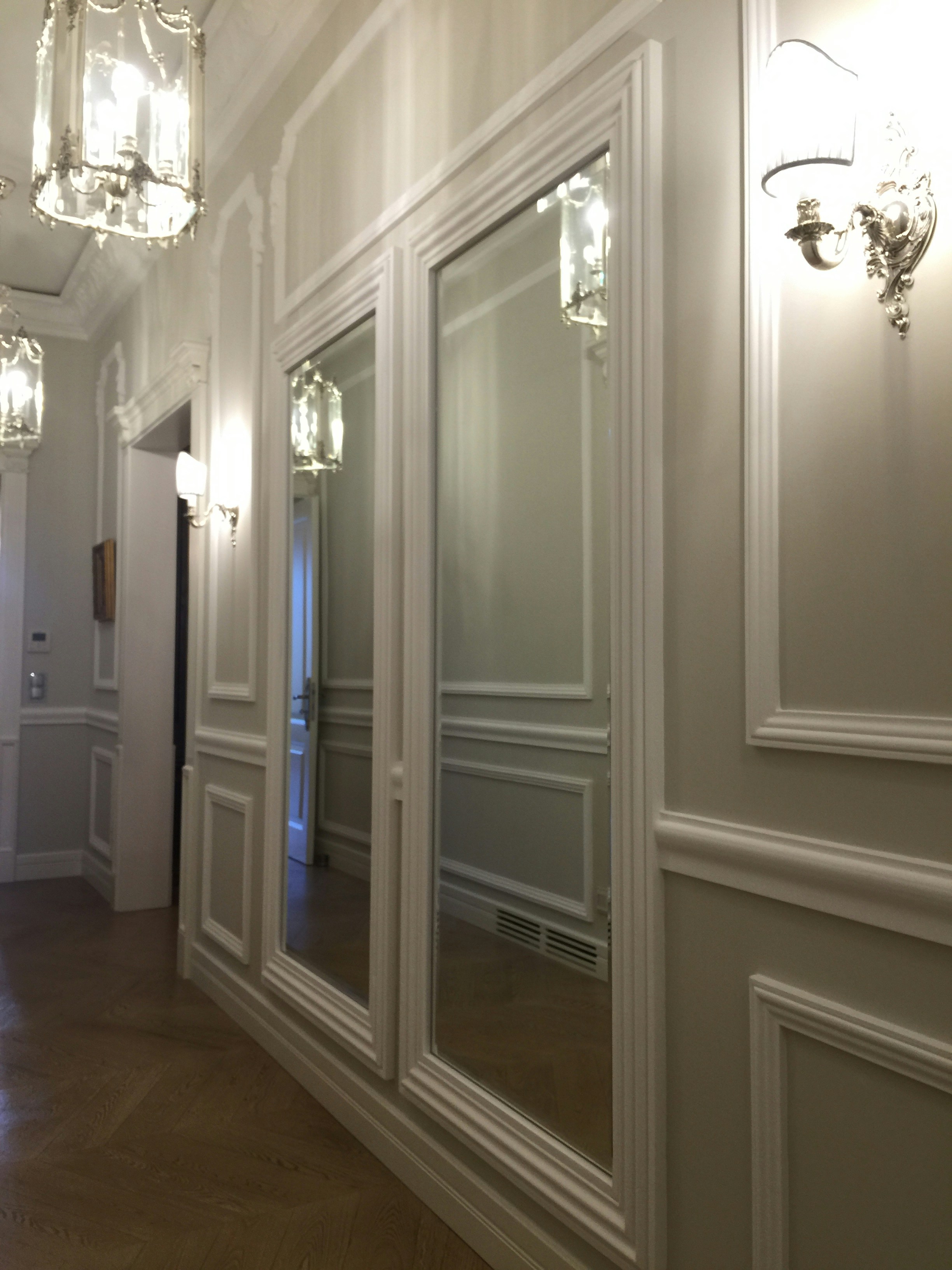 A hallway with a lot of mirrors on the wall photo – Free Interior ...