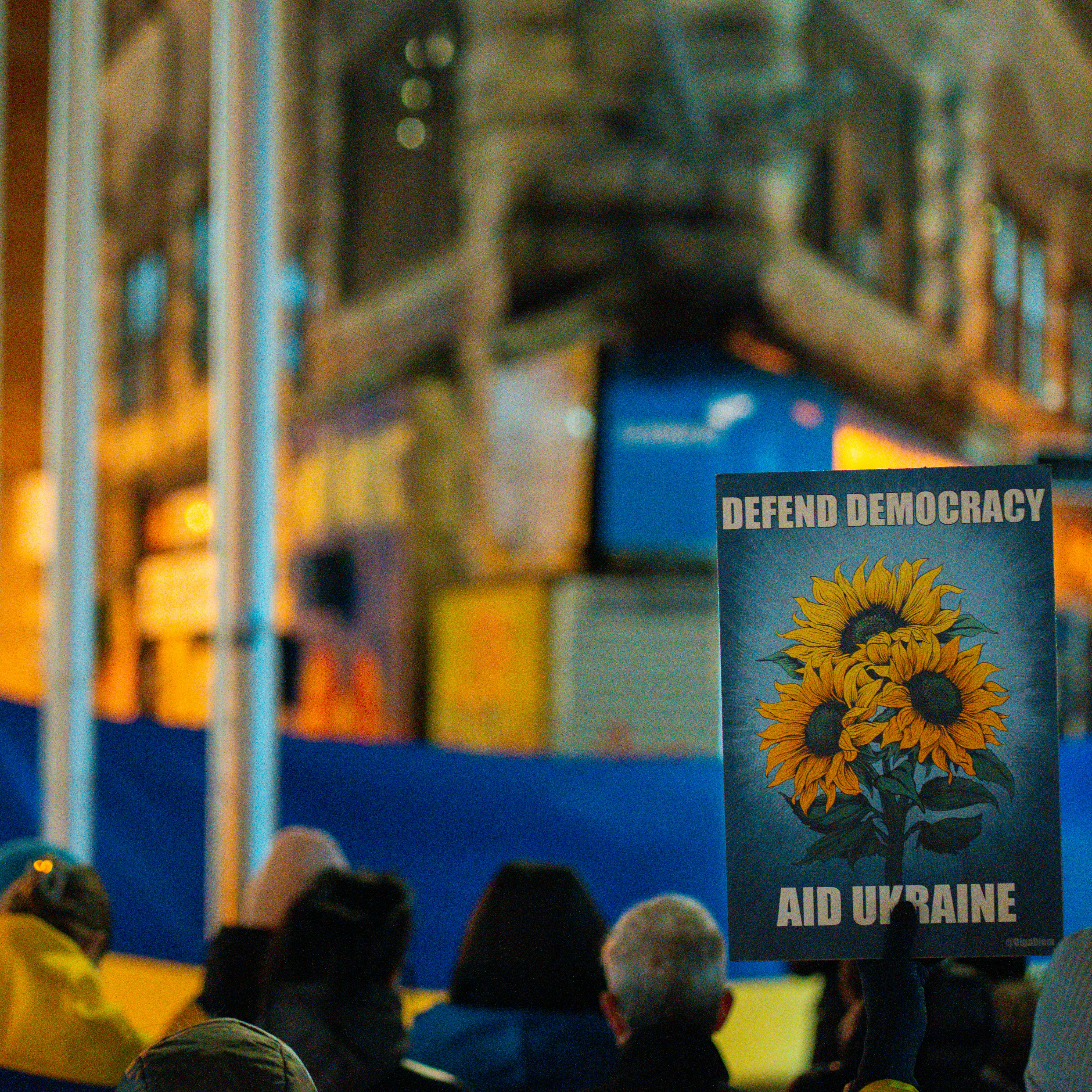 A crowd of people standing around a building